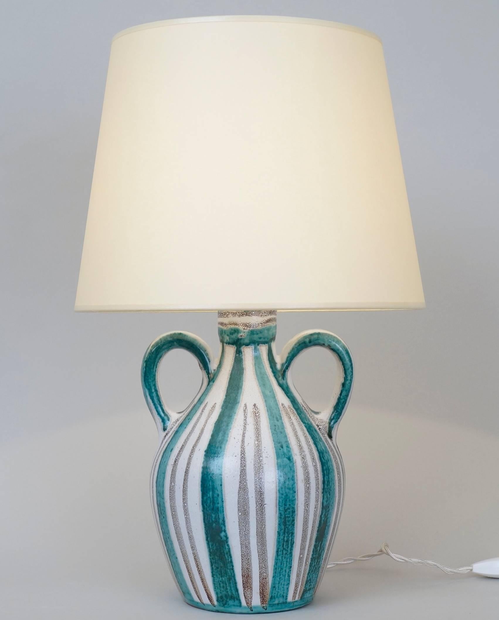 Ceramic table lamp by Robert Picault (1919-2000) Vallauris.
Signed on the back.
Custom-made fabric lampshades.
Rewired with twisted silk cord.
US standard plug on request.
Ceramic height: 22 cm - 8.7 in.
Height with lampshade: 43 cm - 16.9