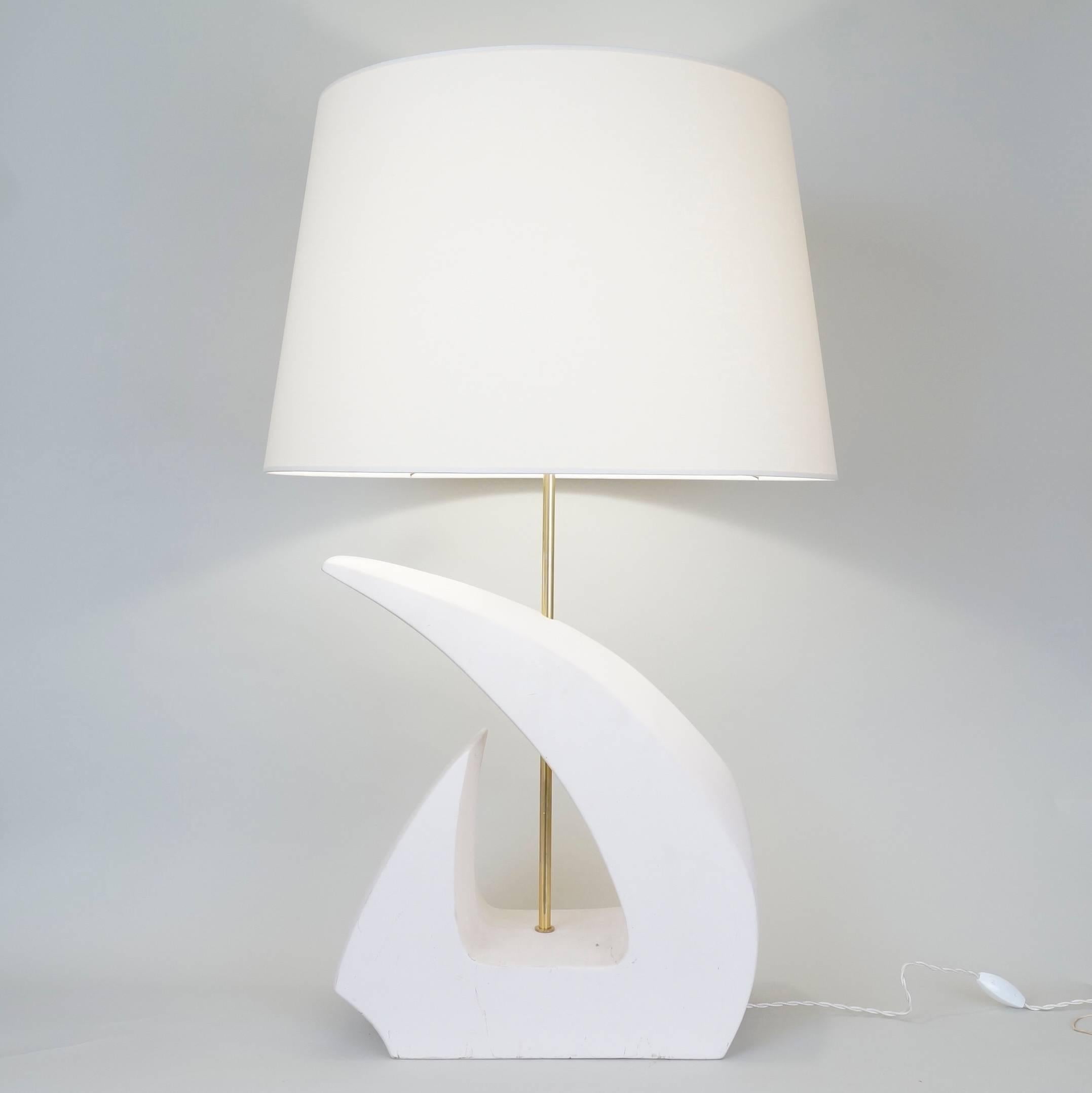Un-enameled white ceramic table lamp, signed on the side Dorion, ceramic factory of Desvres, custom-made fabric lampshade, rewired with twisted silk cord.
US standard plug on request.
Measure: Ceramic body height 47 cm, 18.5 in.
Height with