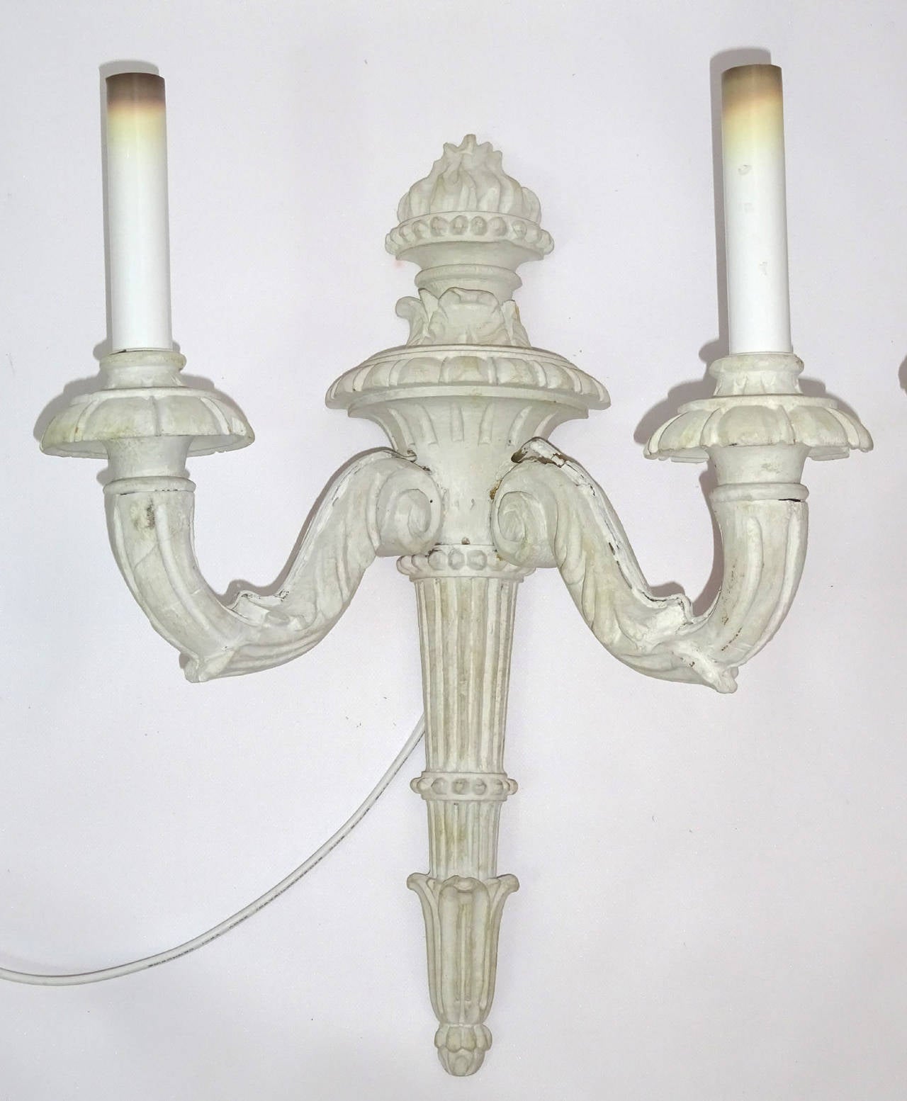 Pair of early 20th century Italian hand-carved two-arm wall sconce in a distressed white painted finish and wired for electricity.