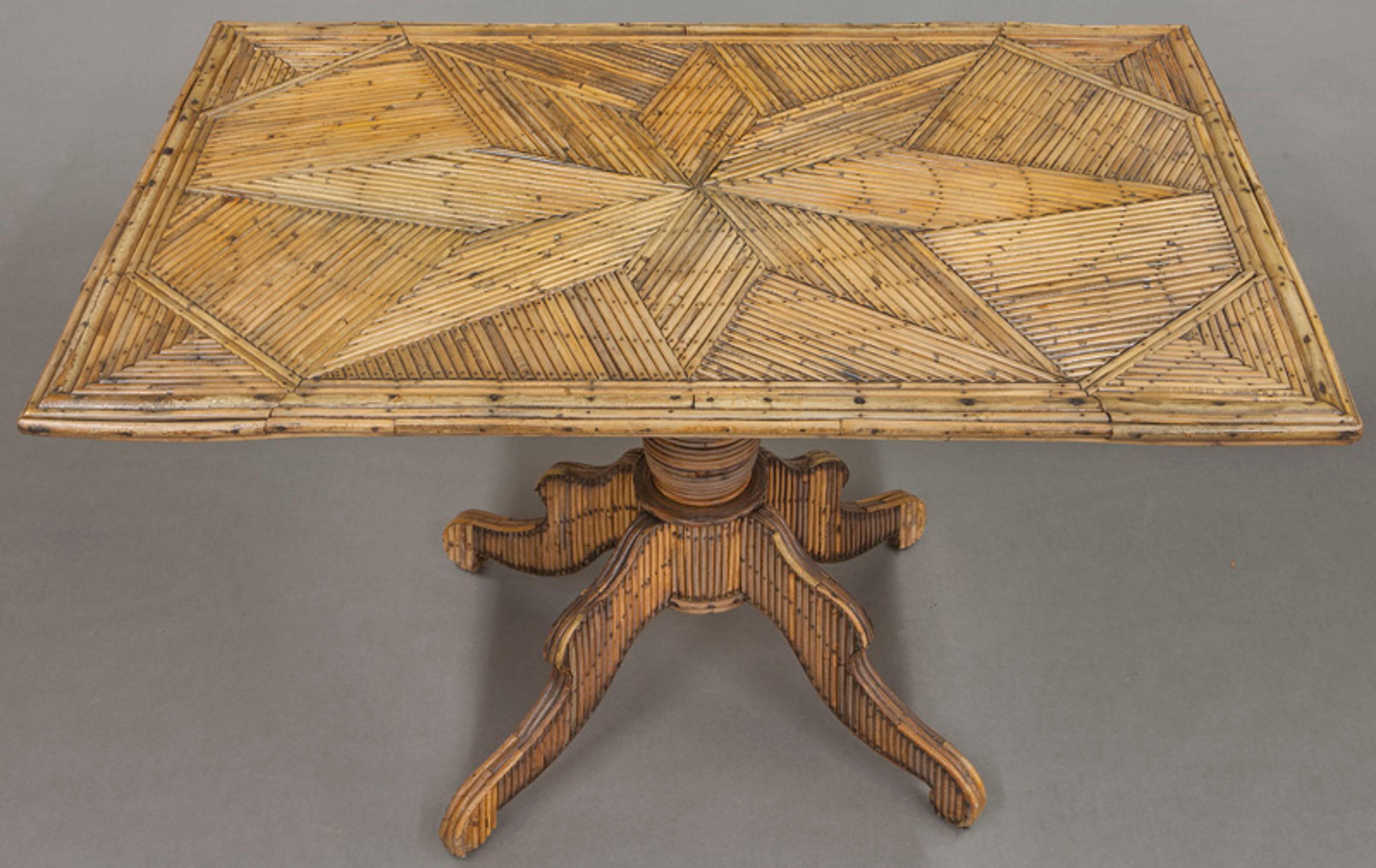 Rustic style centre table composed of teeds. The design of the entire table is composed of split reeds with nails that have oxidized. The patterns and trim are laid so that they mimic more formal furniture style of mid-19th century English. The