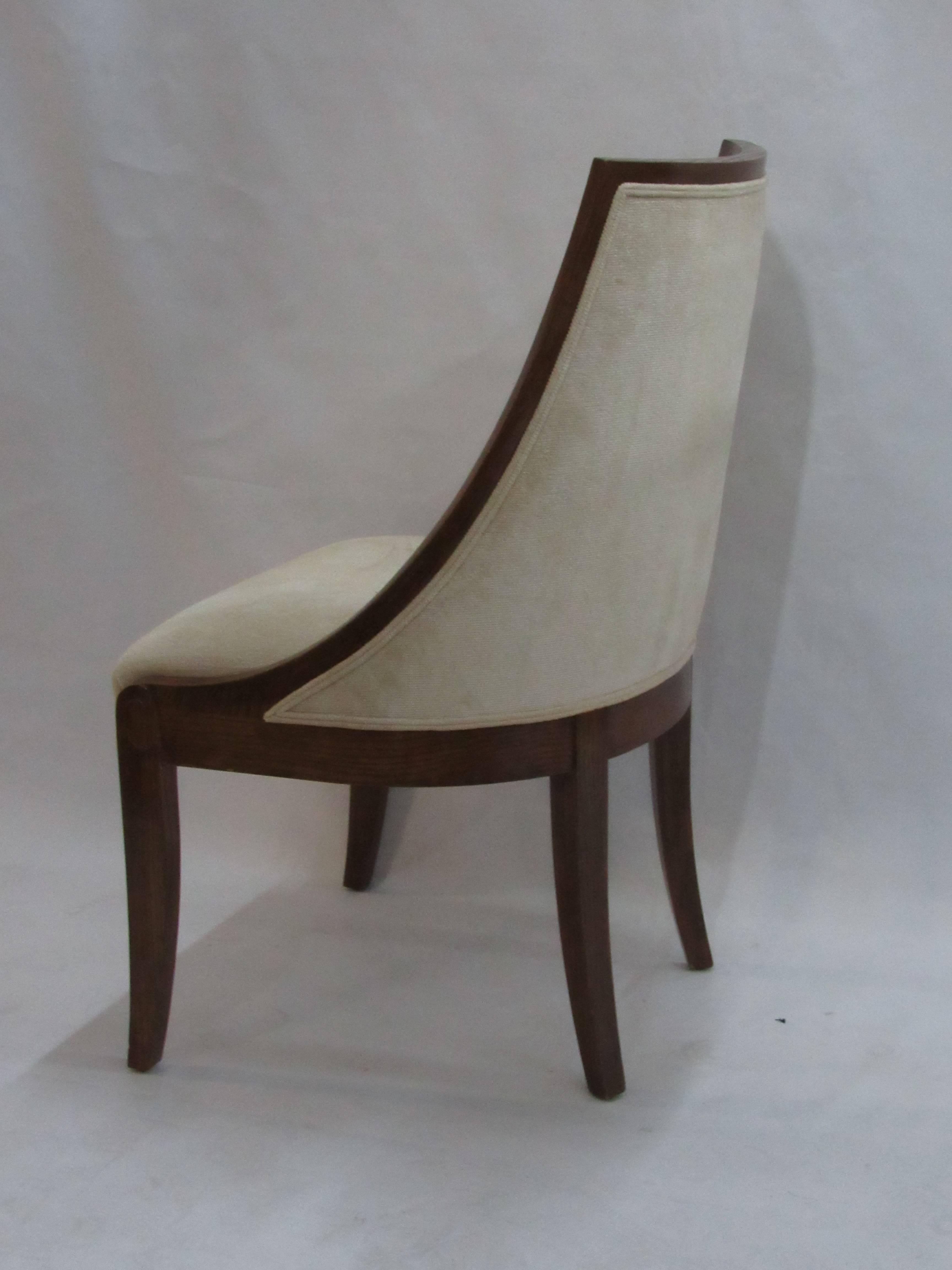 A custom contemporary chair in strie velvet. The Peter Marino designed oak frame is shaped in the style of a simple Directoire design with a clean scroll carving located at the top of the leg. Contemporary ram's chair created by J. Robert Scott for