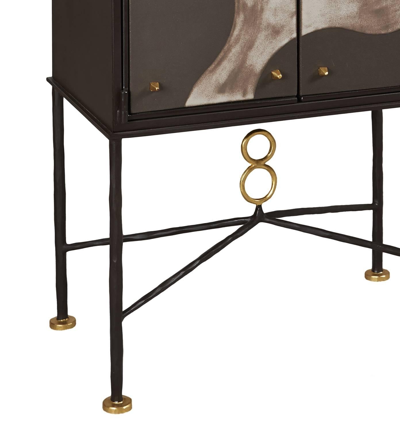 Cabinet, unique piece by Elizabeth Garouste.
Wrought iron and bronze patinated, gilded parts, external parts of the doors in ceramics. Wooden inside.
 