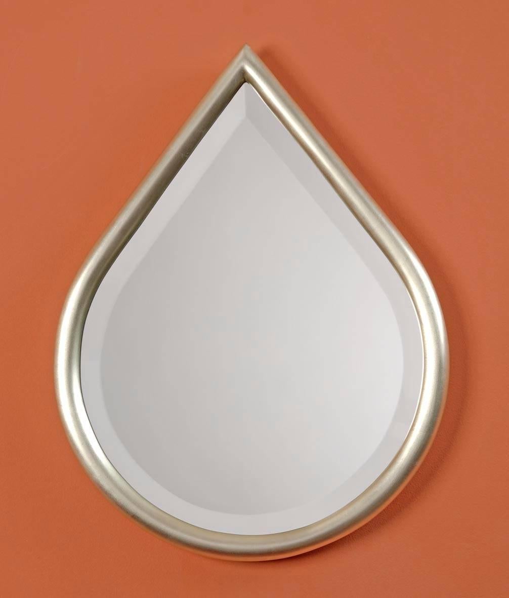 Gilded bevelled mirror in the shape of a drop.