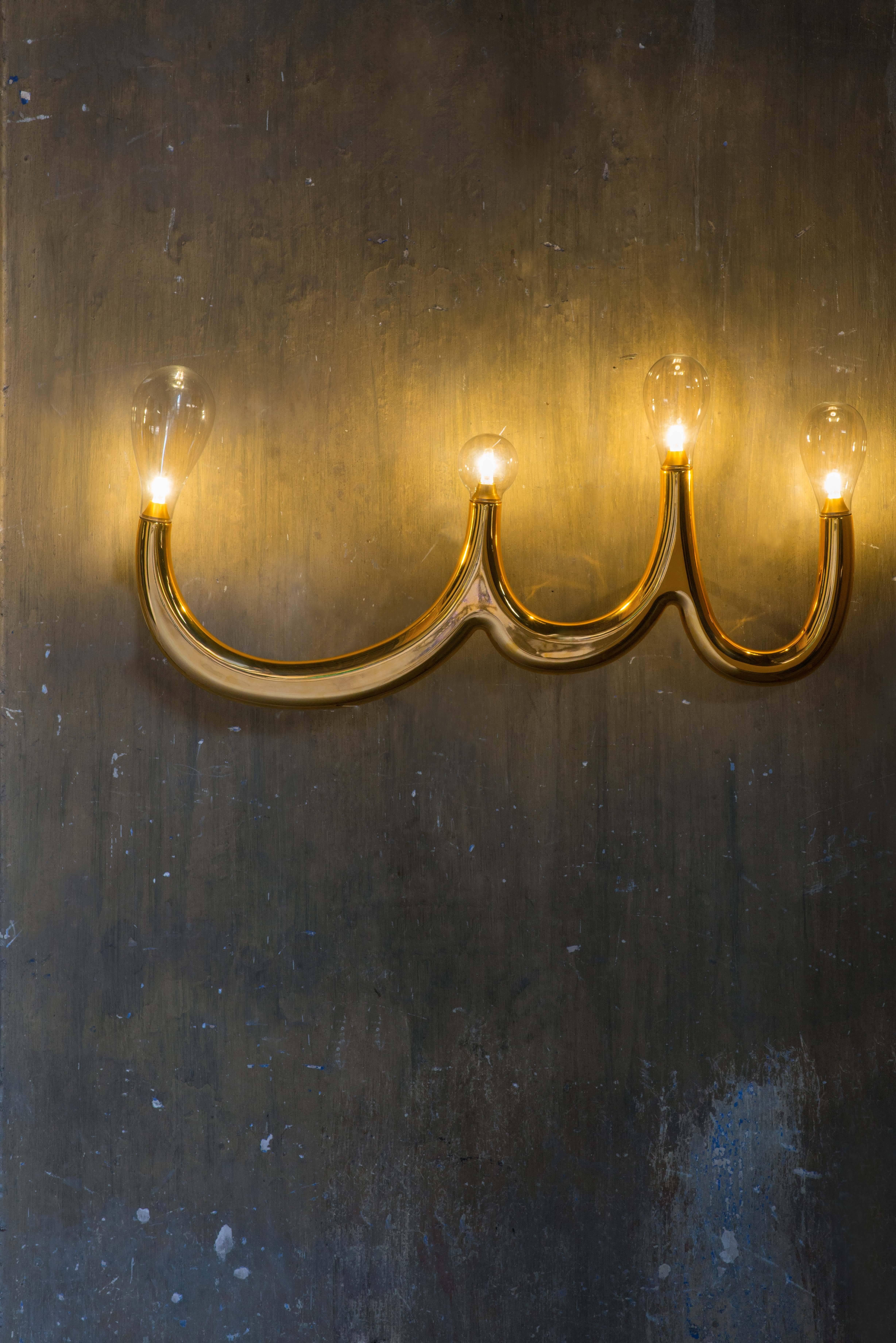 The four bulb wall light created by Matteo Cibic for Scarlet Splendour

The light collection, Luce Naga, captures the fluidity of the serpent’s movement in fine ceramic. The lights are dramatic, never subtle yet Classic in their form and crafted