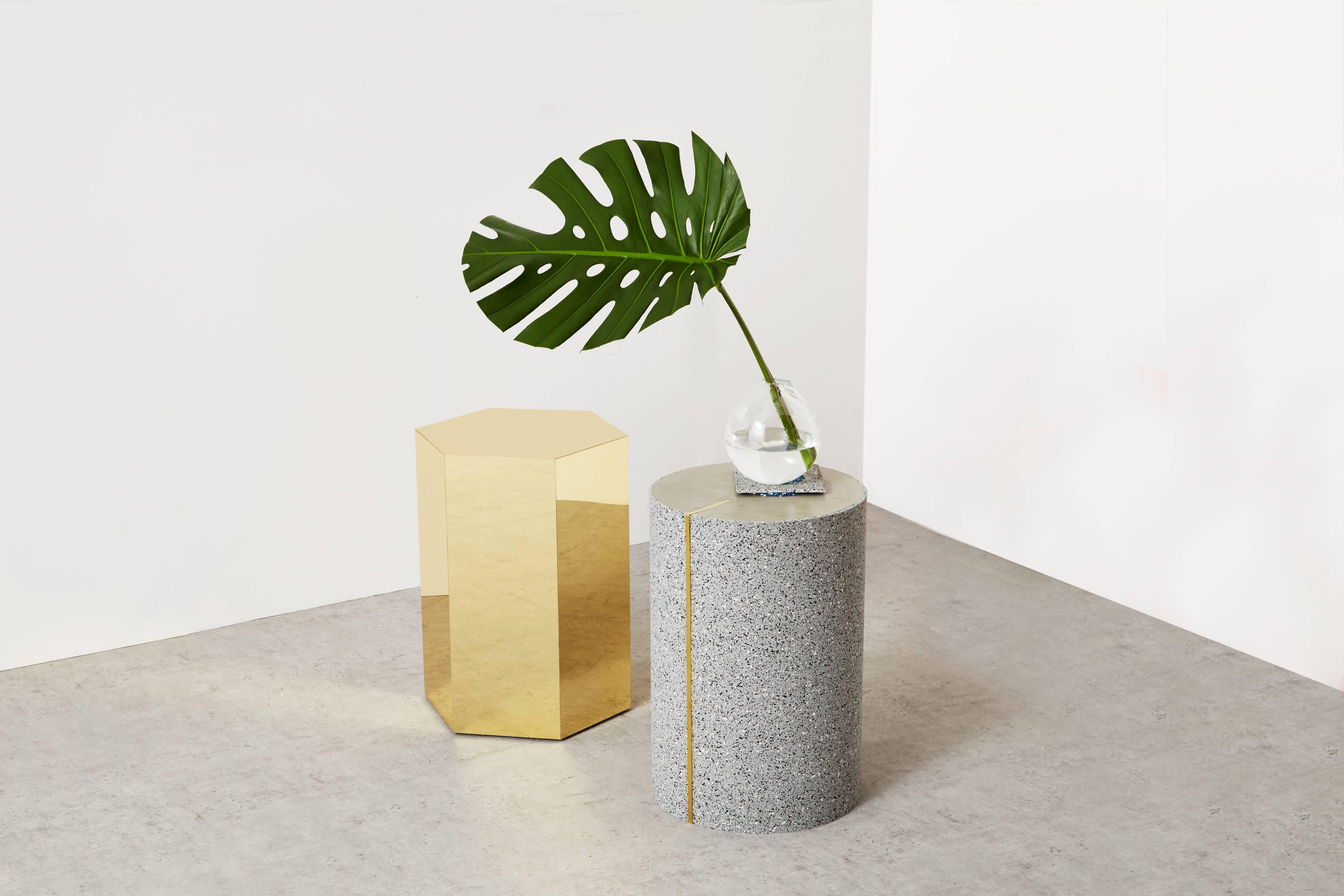 Shiny Hex side table created by Slash Objects.

Materials: Brass and marble.