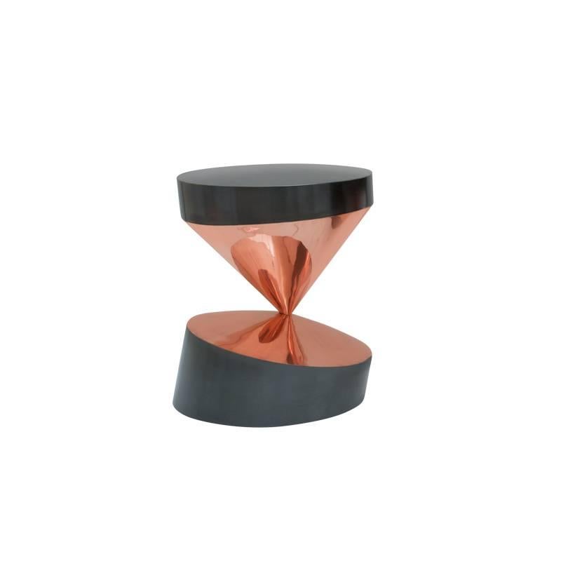 If you want to give a distinct and innovative appeal to your home, then the whirling twins is what you need. This is a pair of small sculptural tables, which look impressive. They feature two cones that are balancing on their tips while maintaining