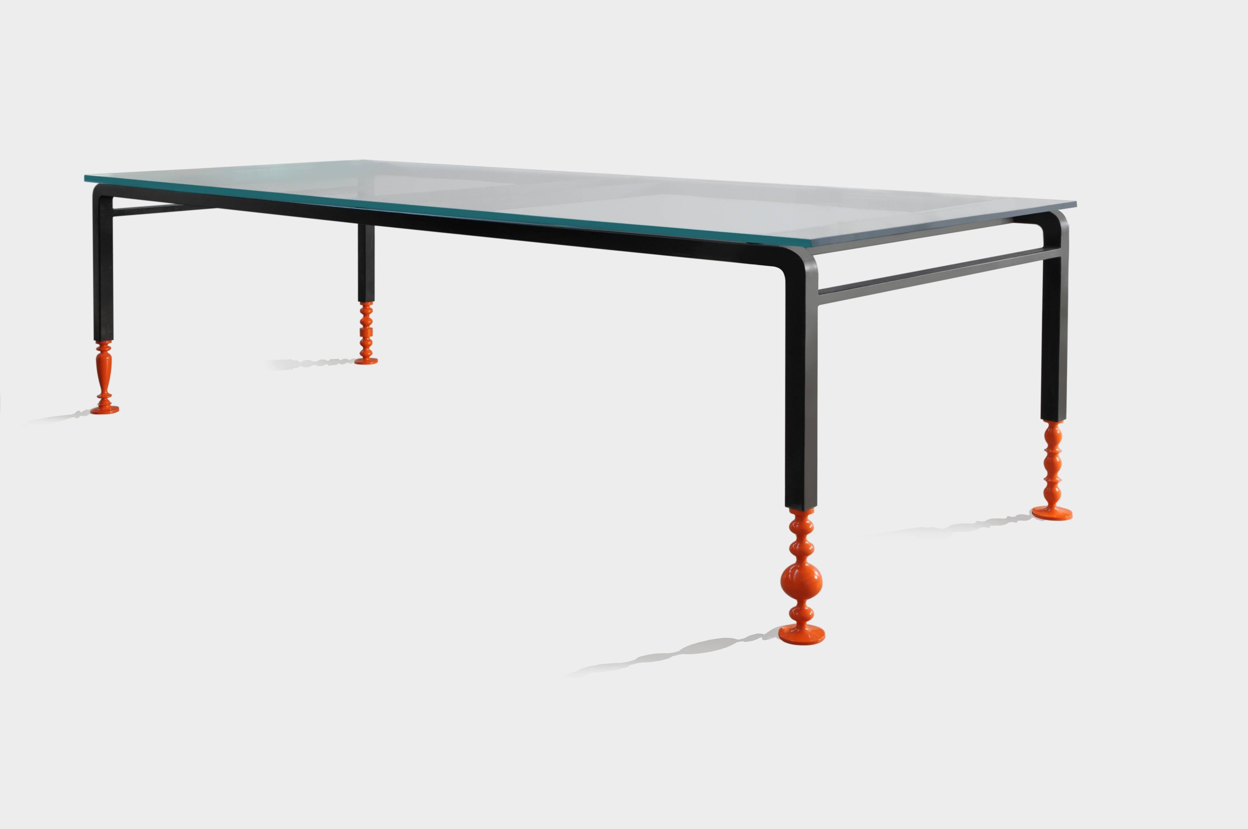 Charpoi table is inspired by the basic bed used in the villages throughout India.
The feet lacquered or chrome-plated give a fragility look as the structure was supported on glass feet. 

Stainless steel, black oxidation, transparent and glossy