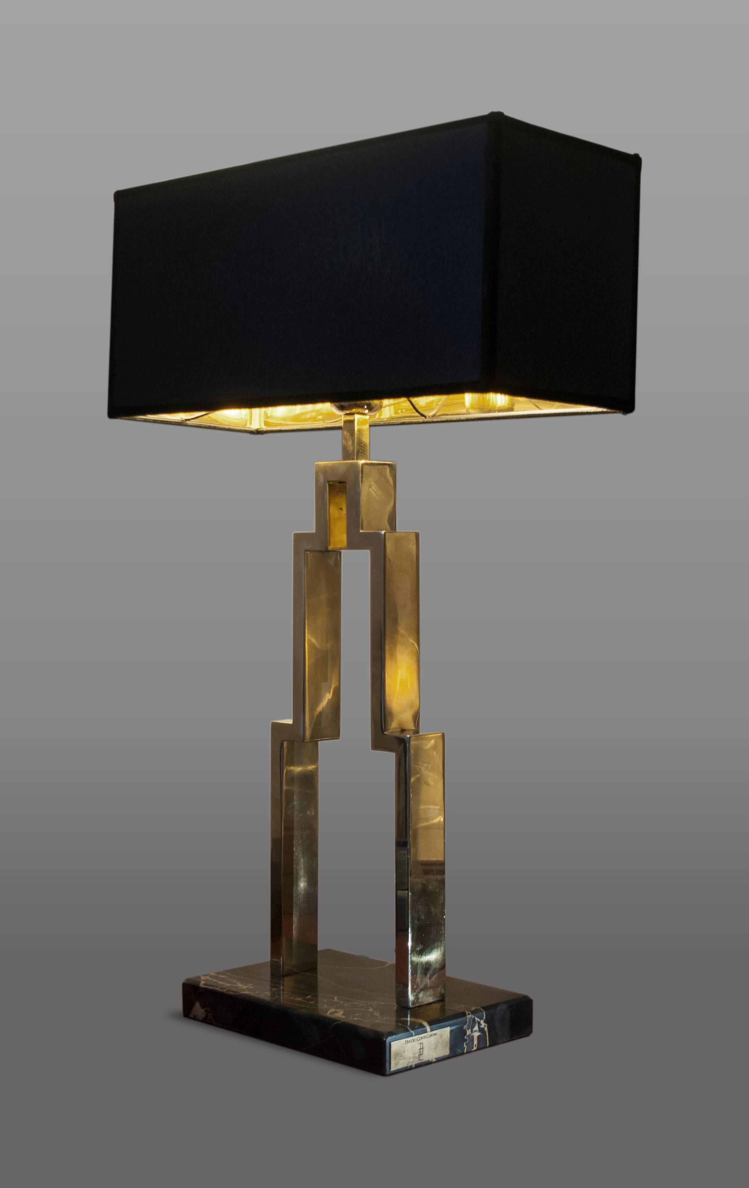 Manhattan brass table lamp created by Duccio Conti Caponi.

Made in Italy

Materials: Polished brass and Portoro marble

Lampshade measurements: 30 cm x 30 cm - h 35 cm.