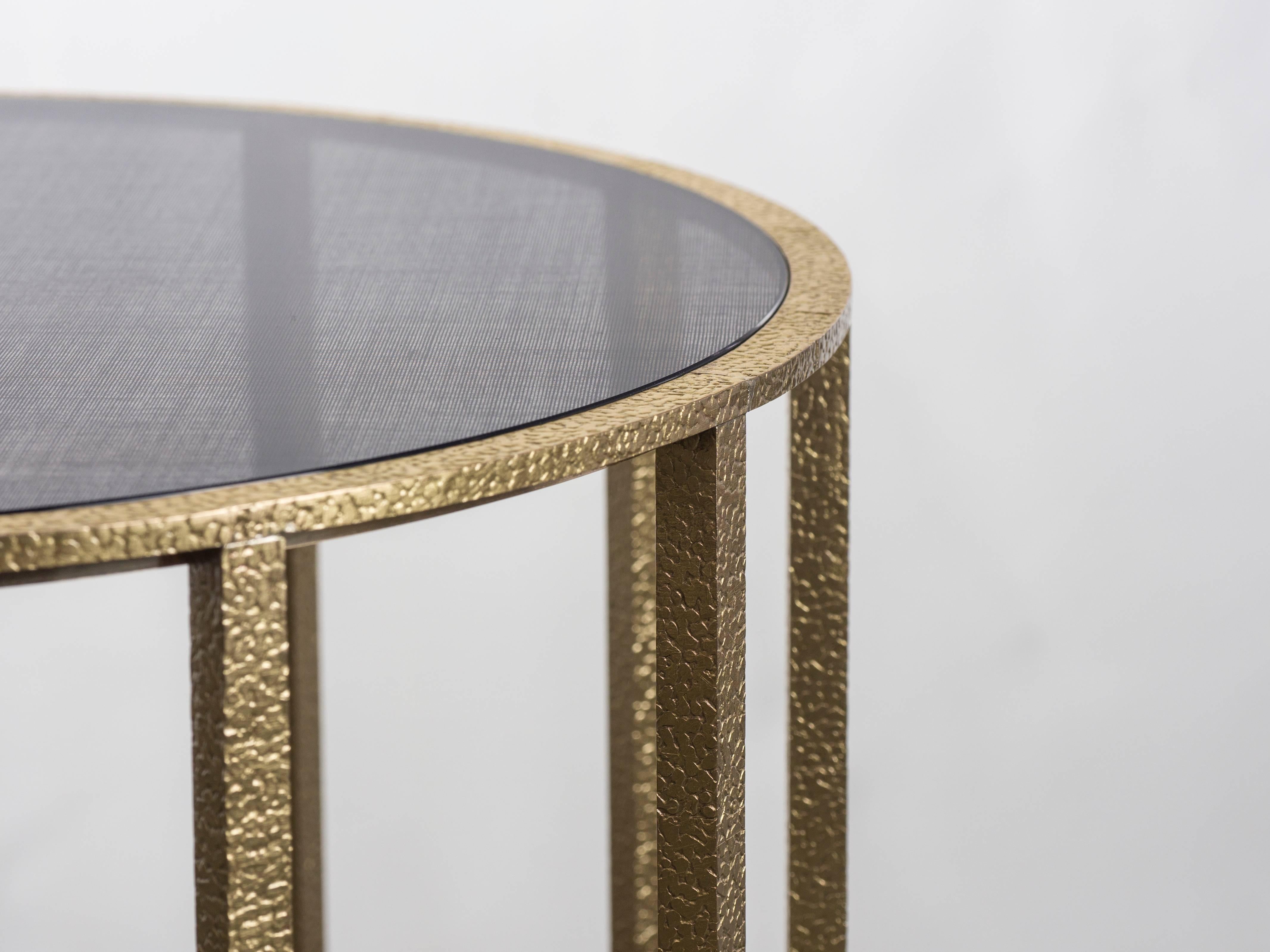 Round ‘Drum’ table 45 cm diameter x 50 cm height. Polished stamped brass with fabric inlay glass.

Created by Carta Bianca

Handmade in Italy.