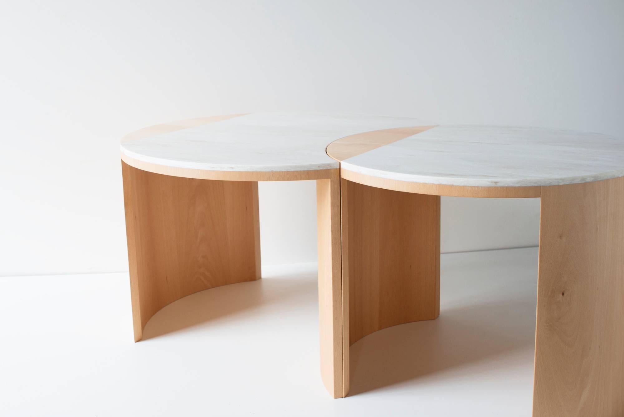 The gibbous coffee table is built in bent plywood, veneer, and Corian. The smaller table is nesting and rotatable, allowing the user an endless number of configurations.

The gibbous coffee table pairs wood and solid surface to create a complex and