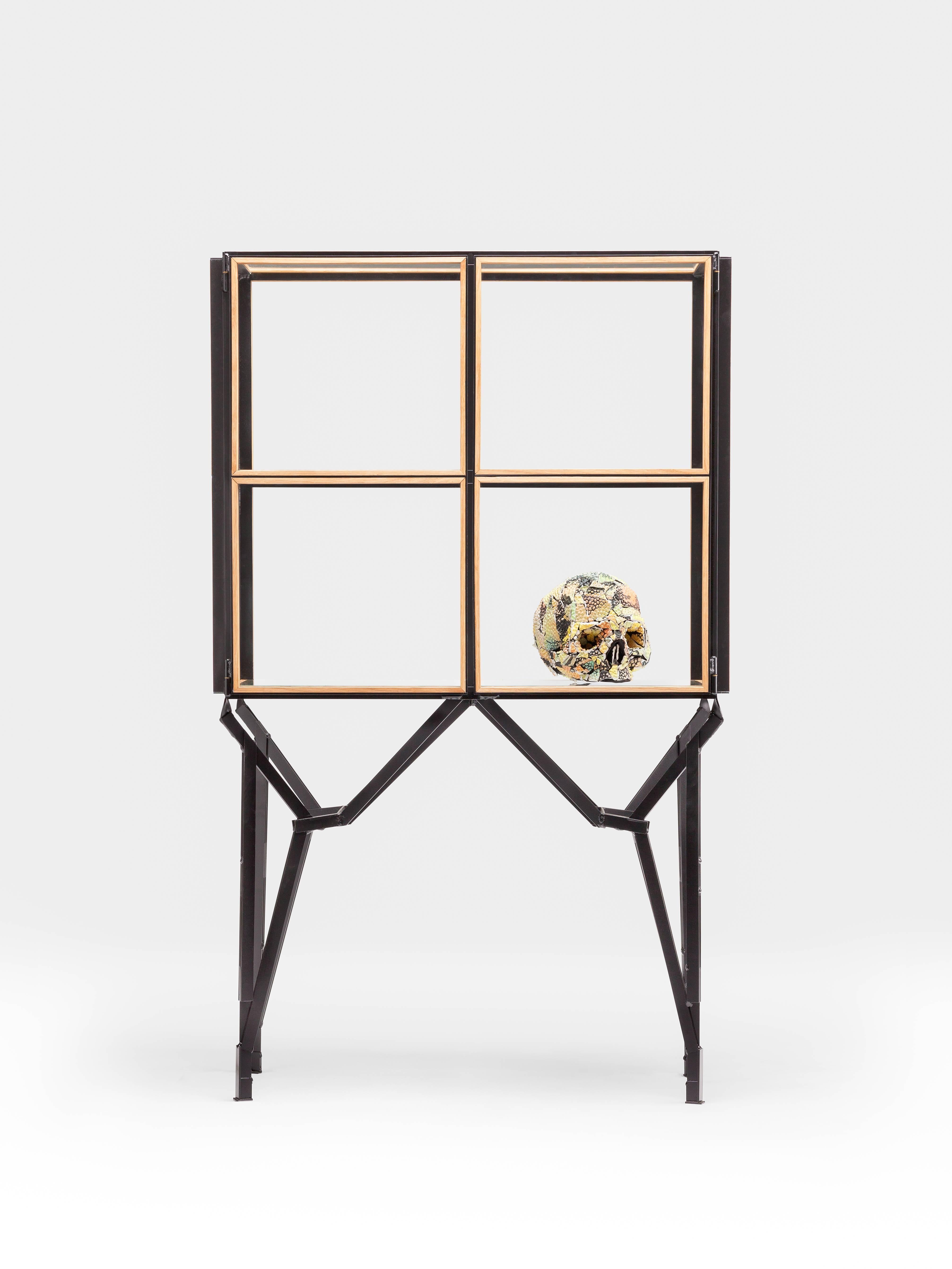 A timeless 2 x 2 cabinet with a modular design and concealed doors to display treasured items.
Inspired on the demolished Philips factory buildings of Eindhoven and their windows.
Handcrafted wooden glass-slats holding glass panels set in a