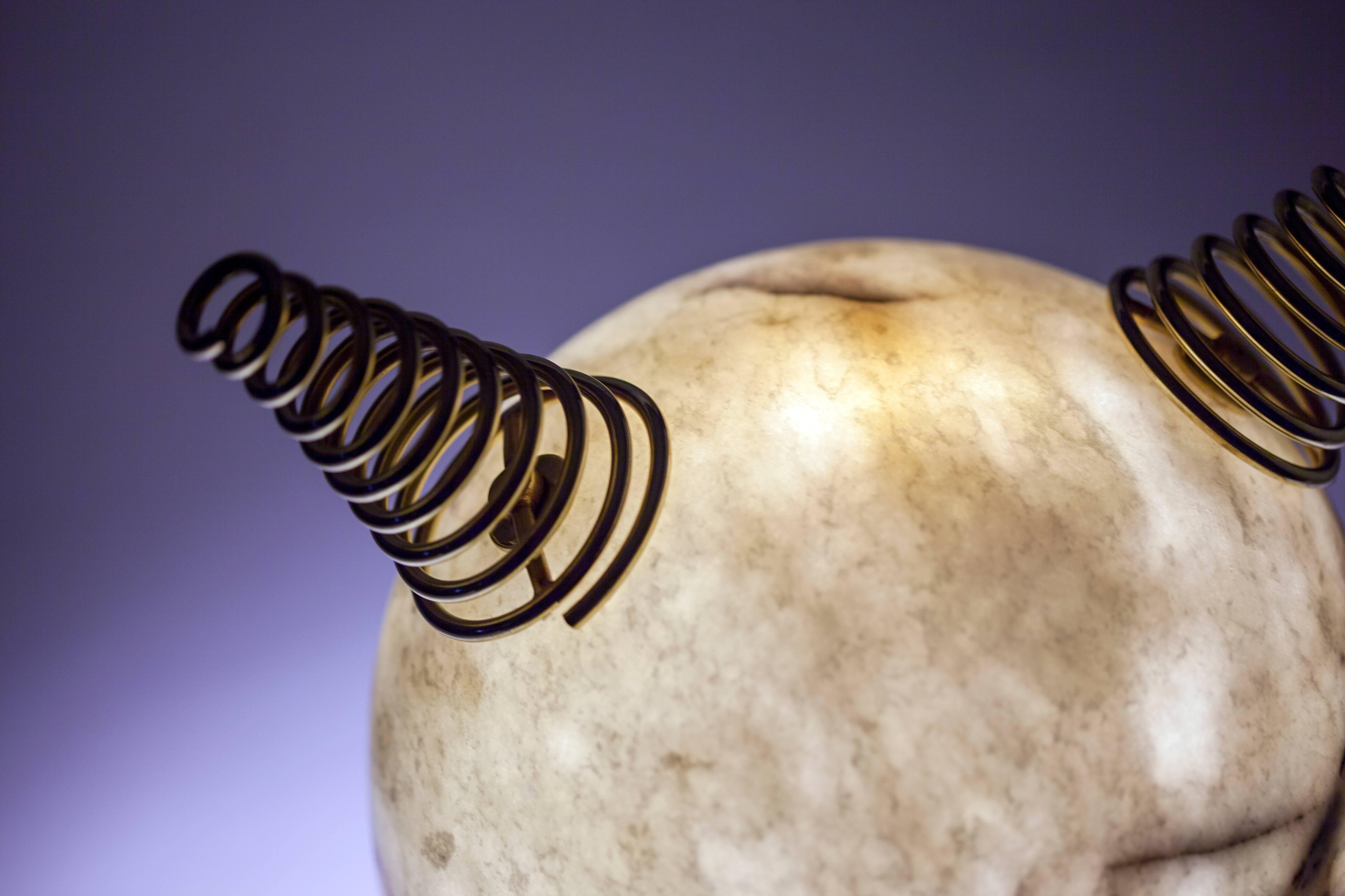 Min Lilla Anime is the new version of the Min Lilla Viking lamp. Horns are replaced with the swivel metal strings resembling the hair of the Japanese anime characters. Veins of the Leylak marble gives out a purplish hue.

Materials: Leylak Marble