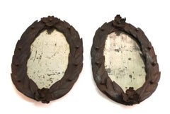 Pair of French Neoclassical Wrought-Iron Mirrors with Laurel-Leaf Borders, 18th