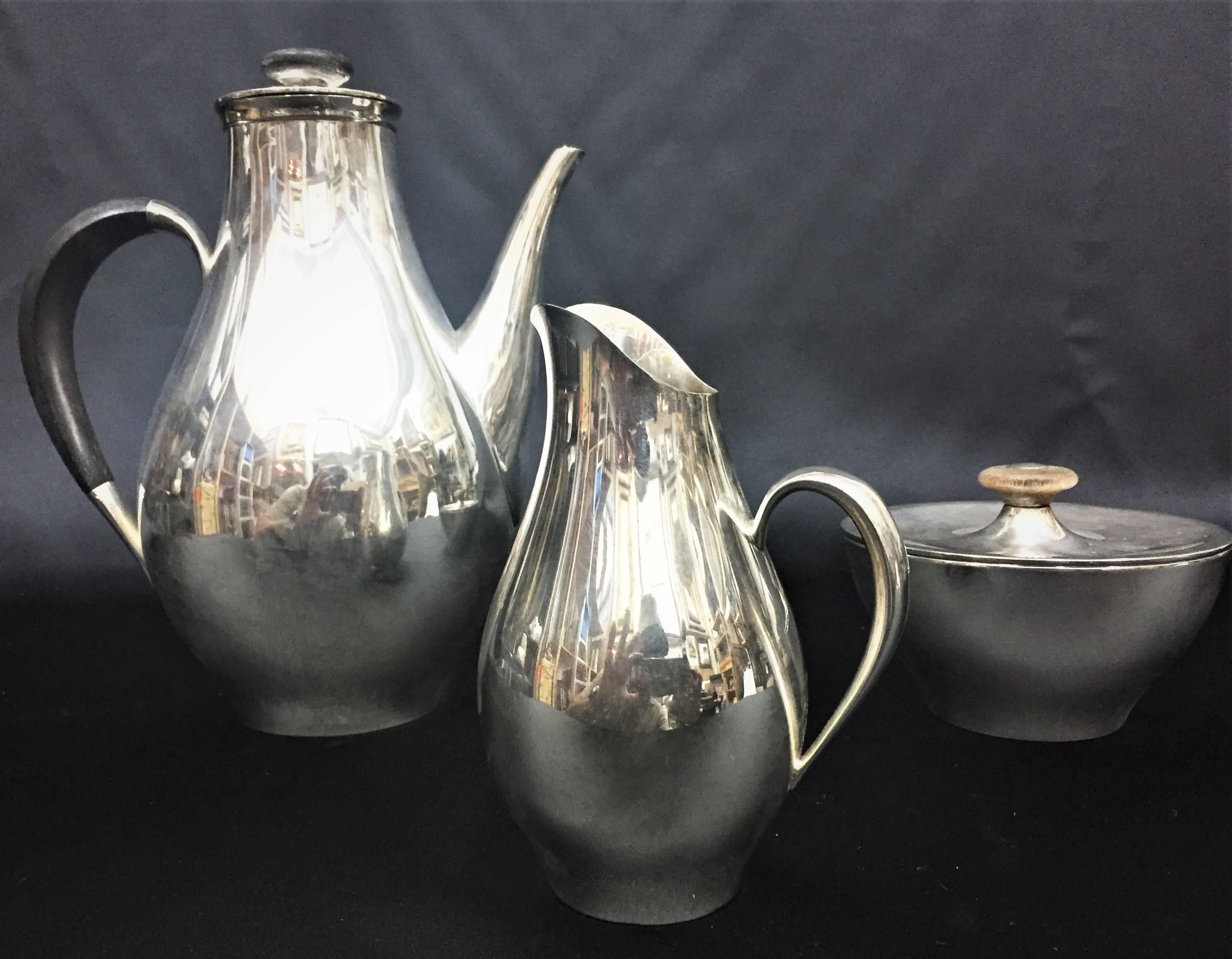Gorham Mid-Century Modern sterling silver trio coffee service, circa 1950s.
Measures: Coffee pot:
Height 8.75”
width 7.75”
weight 22oz

Creamer:
Height 5.25”
width 3.75”
weight 5.6oz

Sugar bowl: 
Height: 3”
width: 4.3”
weight:
