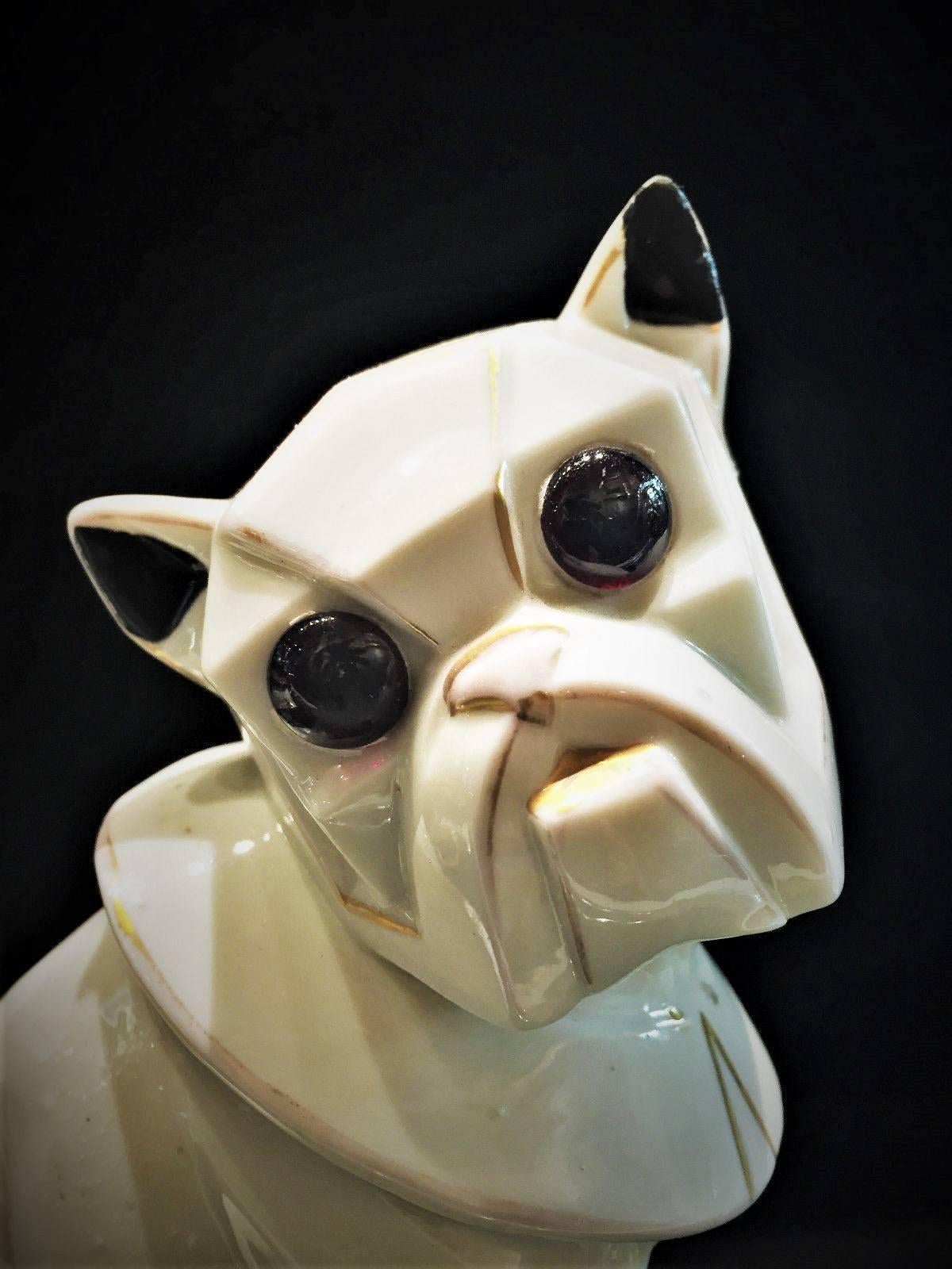 A rare Art Deco Cubist white porcelain nightstand lamp in form of a French Bulldog with gilt details, dating from 1920s, Germany. The dog's eyes and tips of the ears are hand-painted black. Though unmarked, it is most likely produced by Sitzendorf.