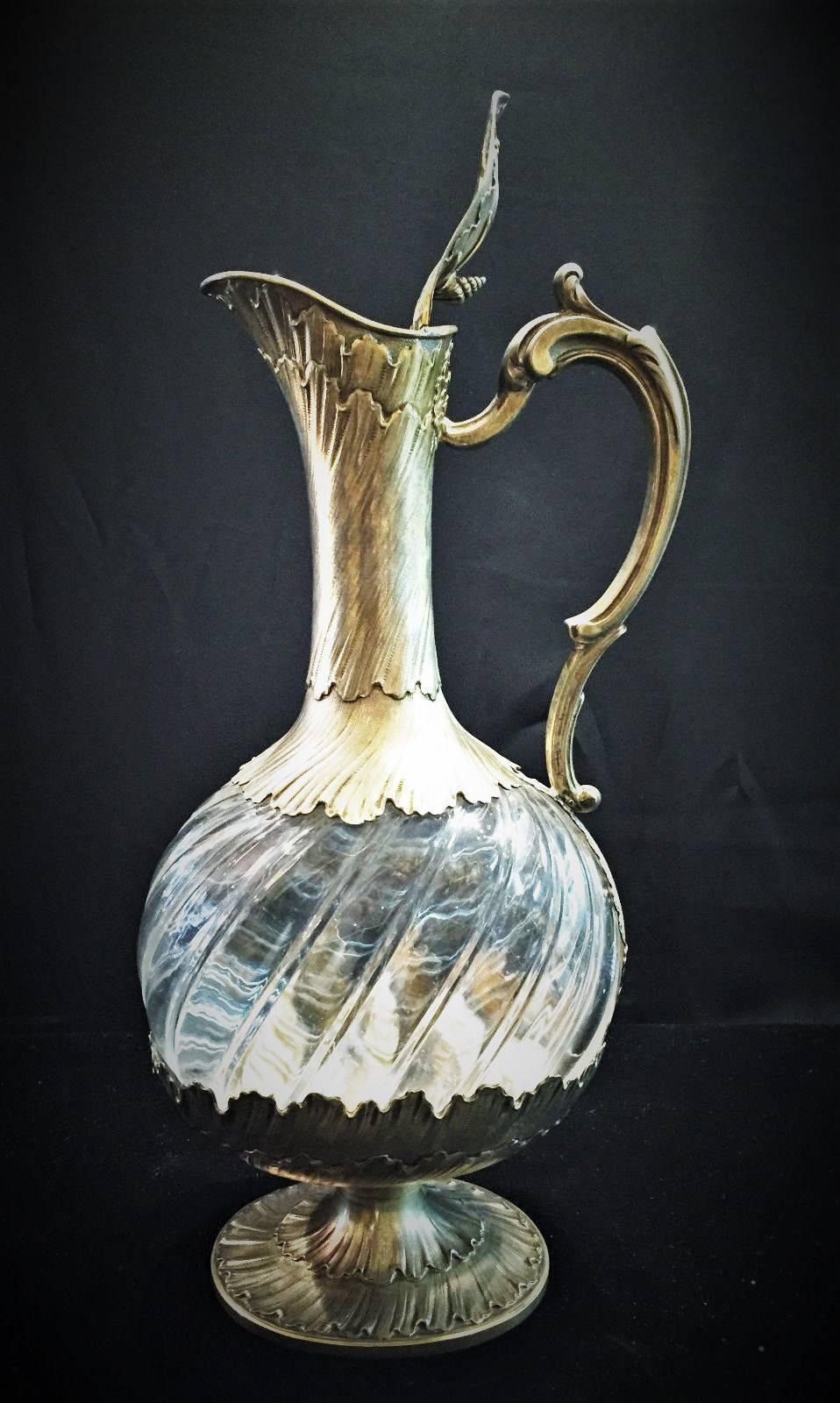 Made in Paris by Maison Odiot circa 1900, this .950 silver-gilt mounted rock crystal claret jug is an extraordinary example of the unique skills of their artisans. What makes it extraordinary is the outstanding design and composition, where the rock
