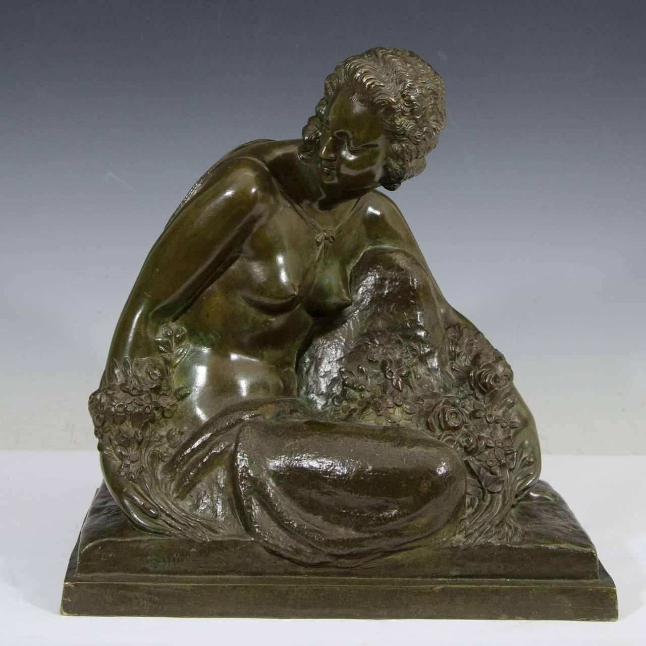 Sculpture en bronze Art déco d'une femme semi-nue assise par Marcel-André Bouraine, français, 1886-1948.