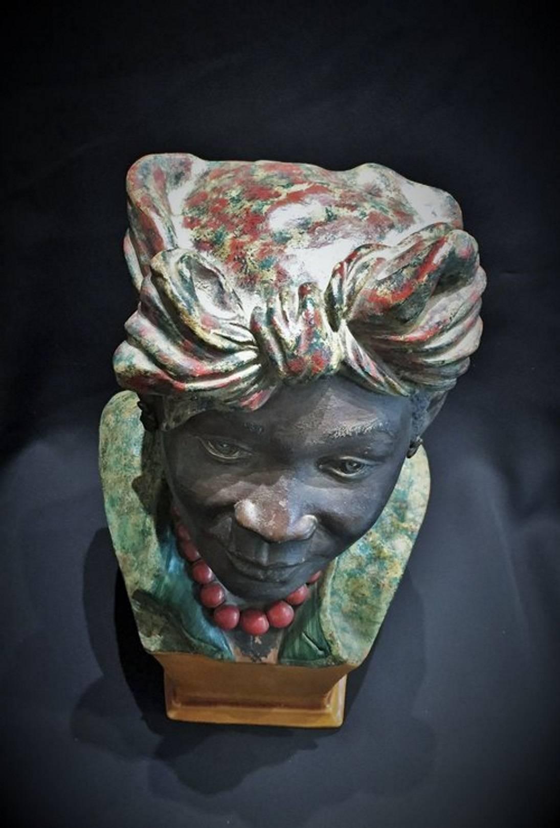 This exquisite and very unusual sculptural bust of a woman in a folklore Cape Verde Island costume, wearing a coral necklace and a bright headscarf was made in the last quarter of XIX Century; probably, on the Portuguese colonial island of Cape