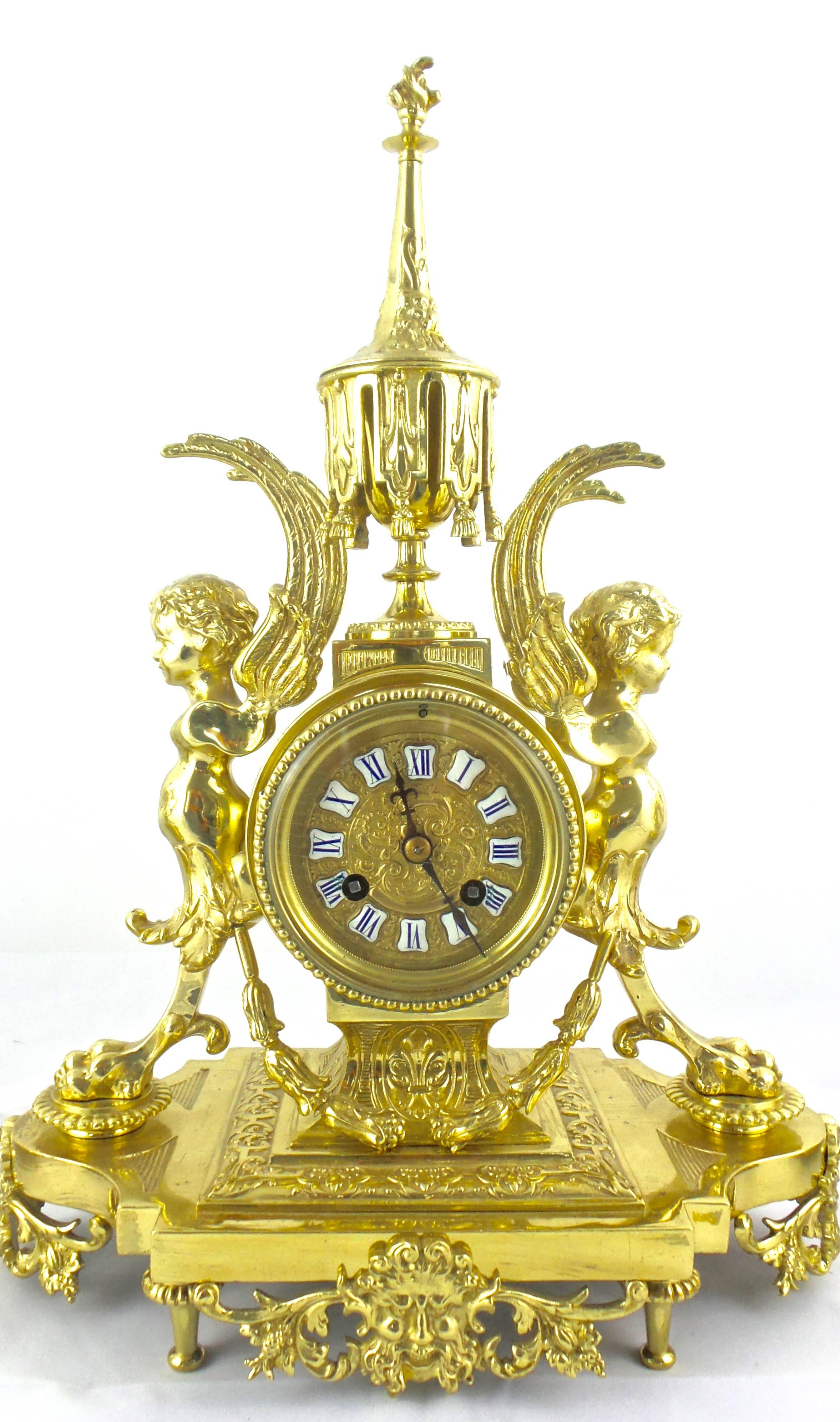 An original authentic antique 19th century French solid gilt brass mantel clock garniture set of rare design with initials D.C impressed
Palace and museum quality clock set 
Original matching candelabra garnitures 
Elaborate designs all over and