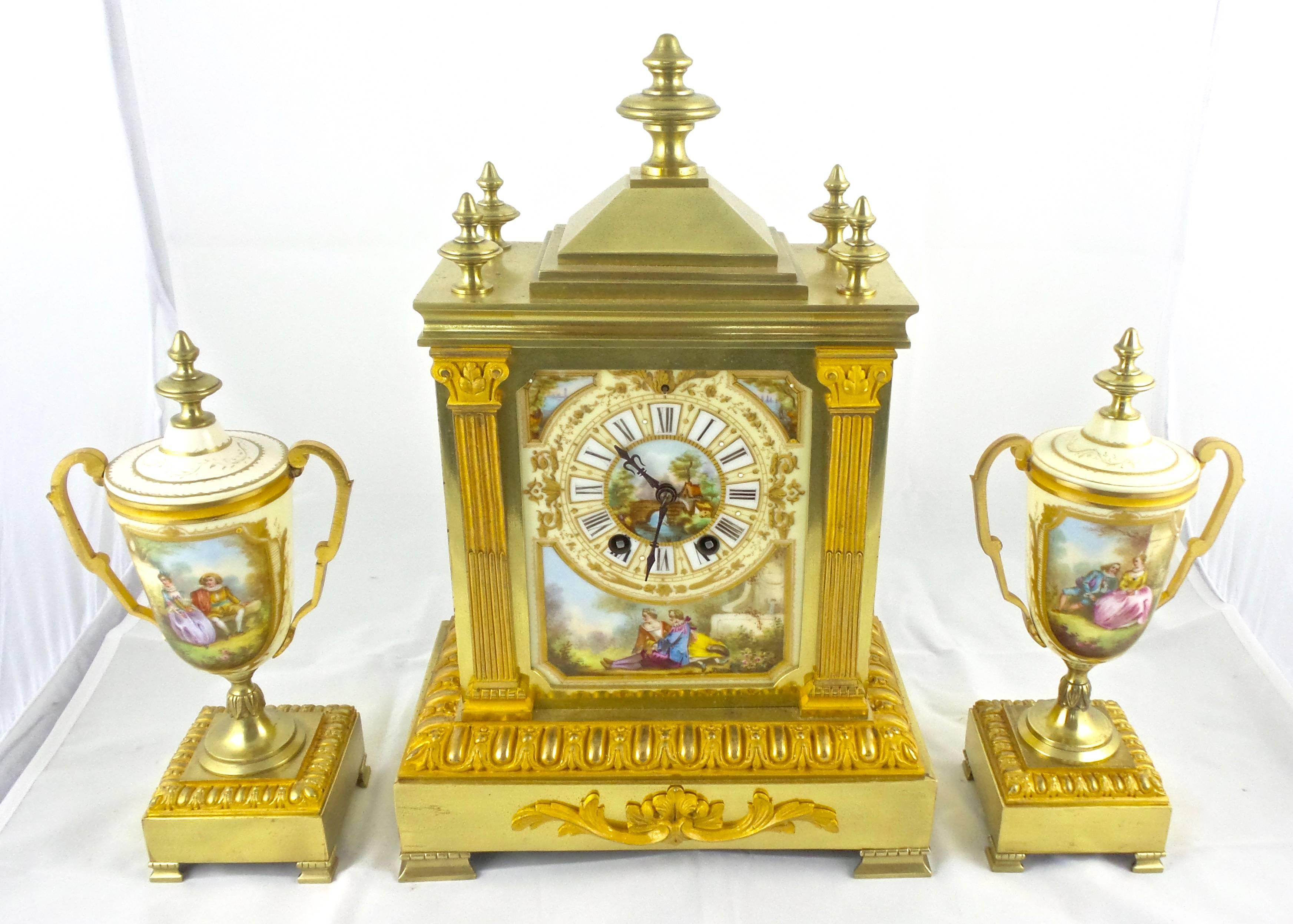 An original authentic antique 19th century French gilt brass three-piece mantel clock garniture set retailed by Boxell of Brighton 
Very impressive clock set and with hand-painted Paris porcelain with romantic scenes in the manner of Sevres 
Fully
