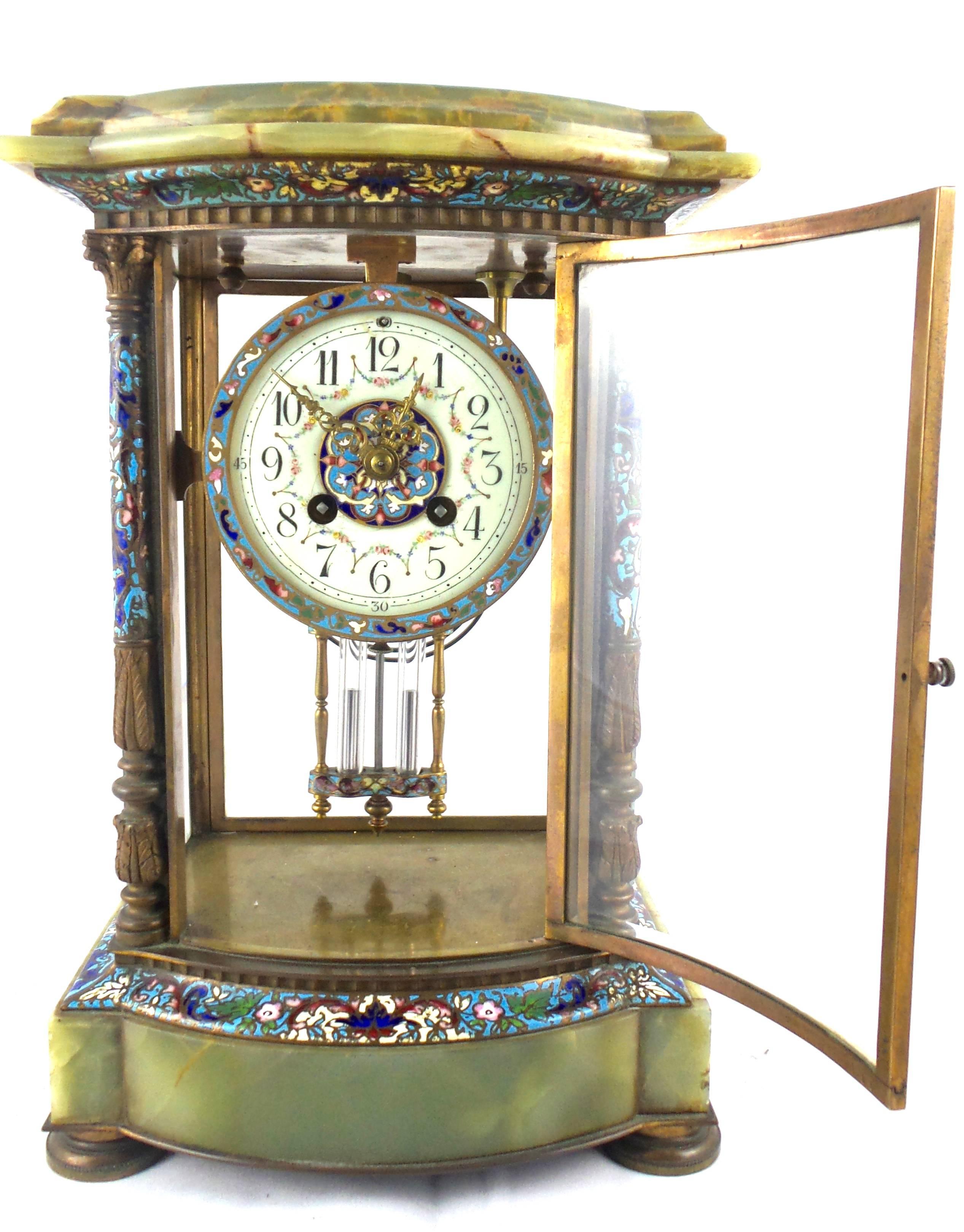 This is an antique 19th century French mantel clock of excellent quality by Japy Freres
A four glass crystal regulator clock in onyx with champleve enamel trims
A full length bevelled and curved front glass door and full length bevelled glass