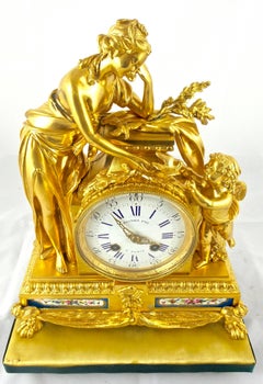 1820s French Empire Gilt Ormolu Bronze and Sevres Mantel Clock by Raingo Freres