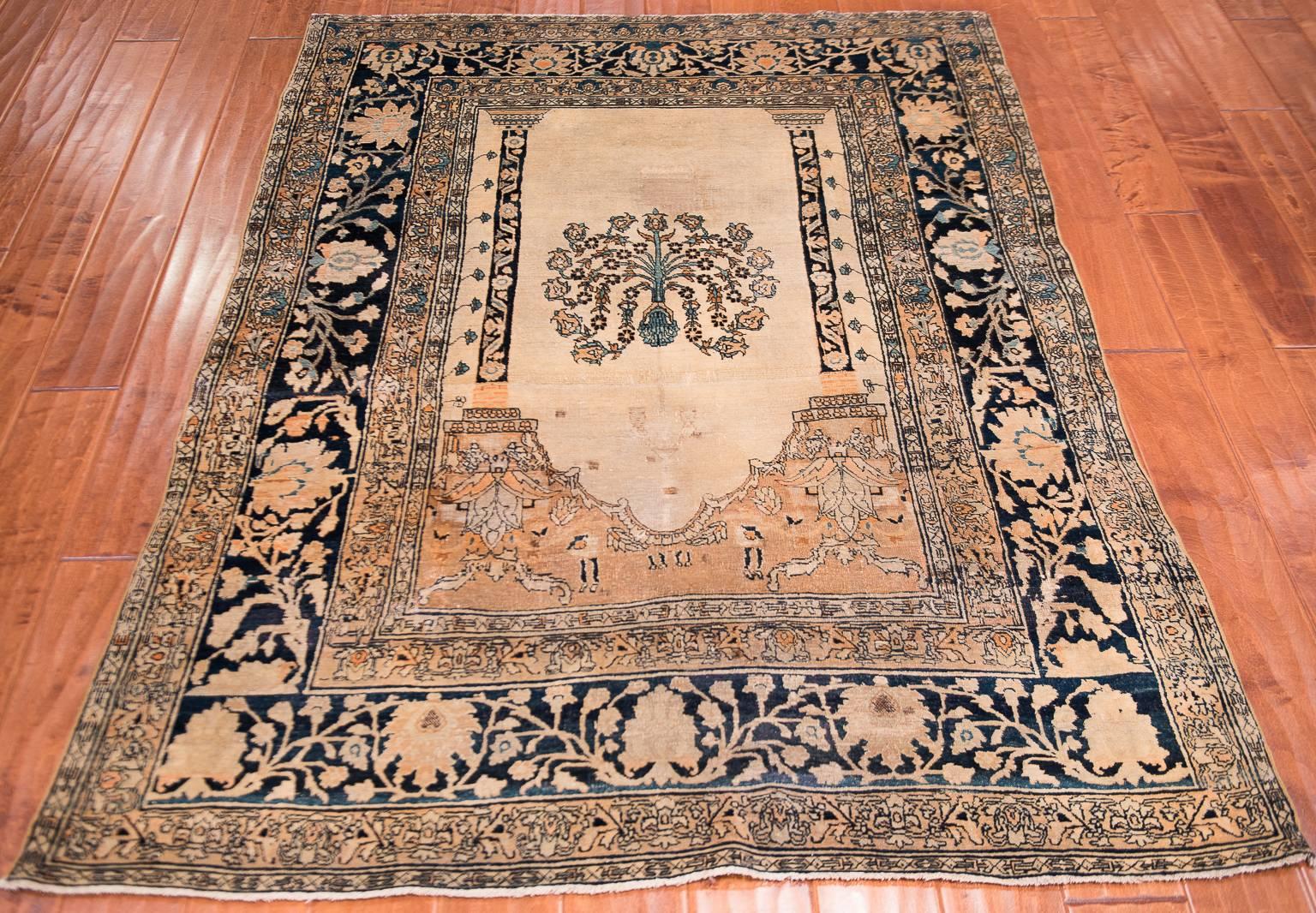 Mid-late 19th century Persian Tabriz prayer rug.
This Tabriz features a singular prayer niche marked out by the central tree on the ivory field.
The wool dyed in this ivory shines forth from this Persian carpet because of the very fine weave
with a