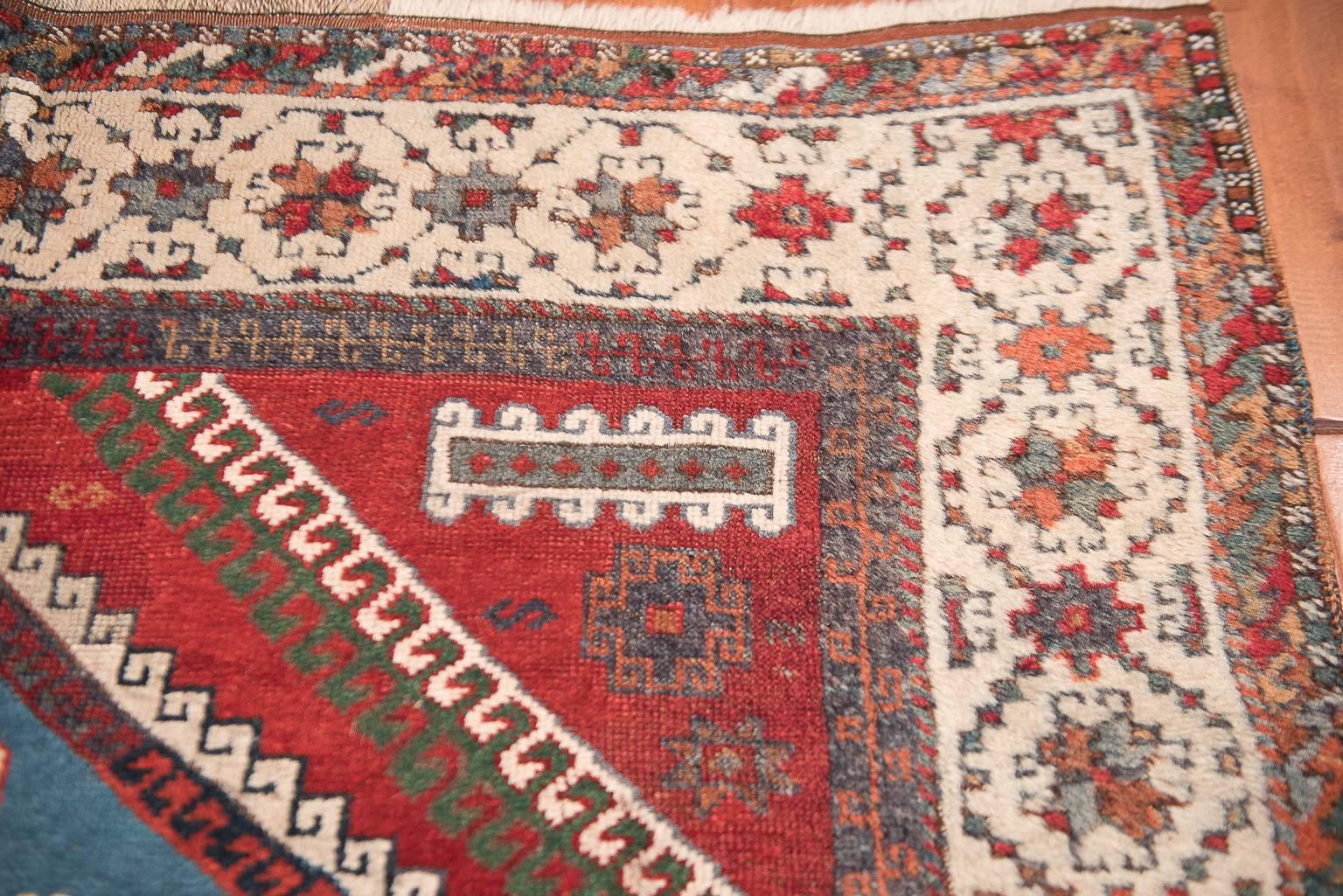 Tribal red antique Kurd carpet.
     Once wrongly identified as Northwest Persian or Caucasian village weaving, antique Kard, or Kurdish rugs have only recently been acknowledged for their unique type of design and dying method. Utilizing a set of