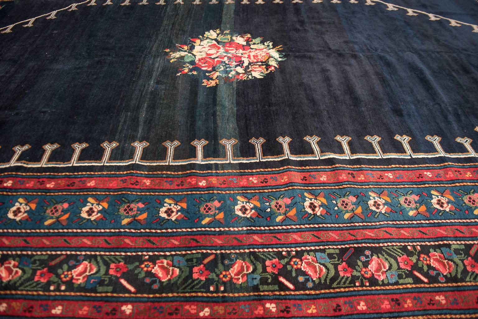Regal blue antique Caucasian Karabagh carpet, circa 1900.
The weavers of the Causcasas Mountain Range were nestled away from the global and historical influences of the Persian rug trade  Antique Karabagh carpets tend to feature floral designs upon