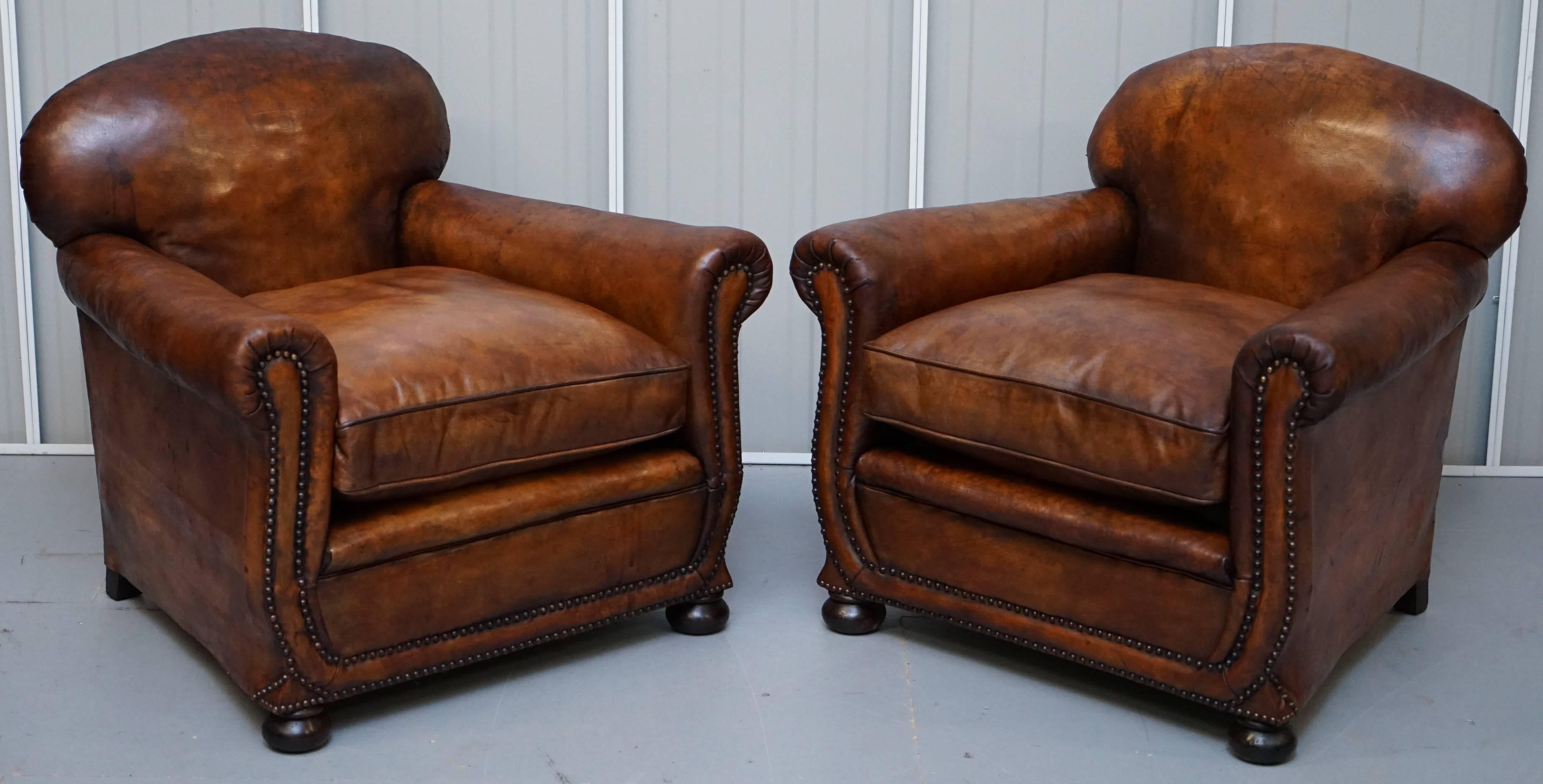 We are delighted to offer for sale this lovely original circa 1910 Edwardian restored hand dyed whiskey brown leather Gentleman's Club three piece suite to include a two-three seat sofa and pair of matching armchairs 

Please note the delivery fee