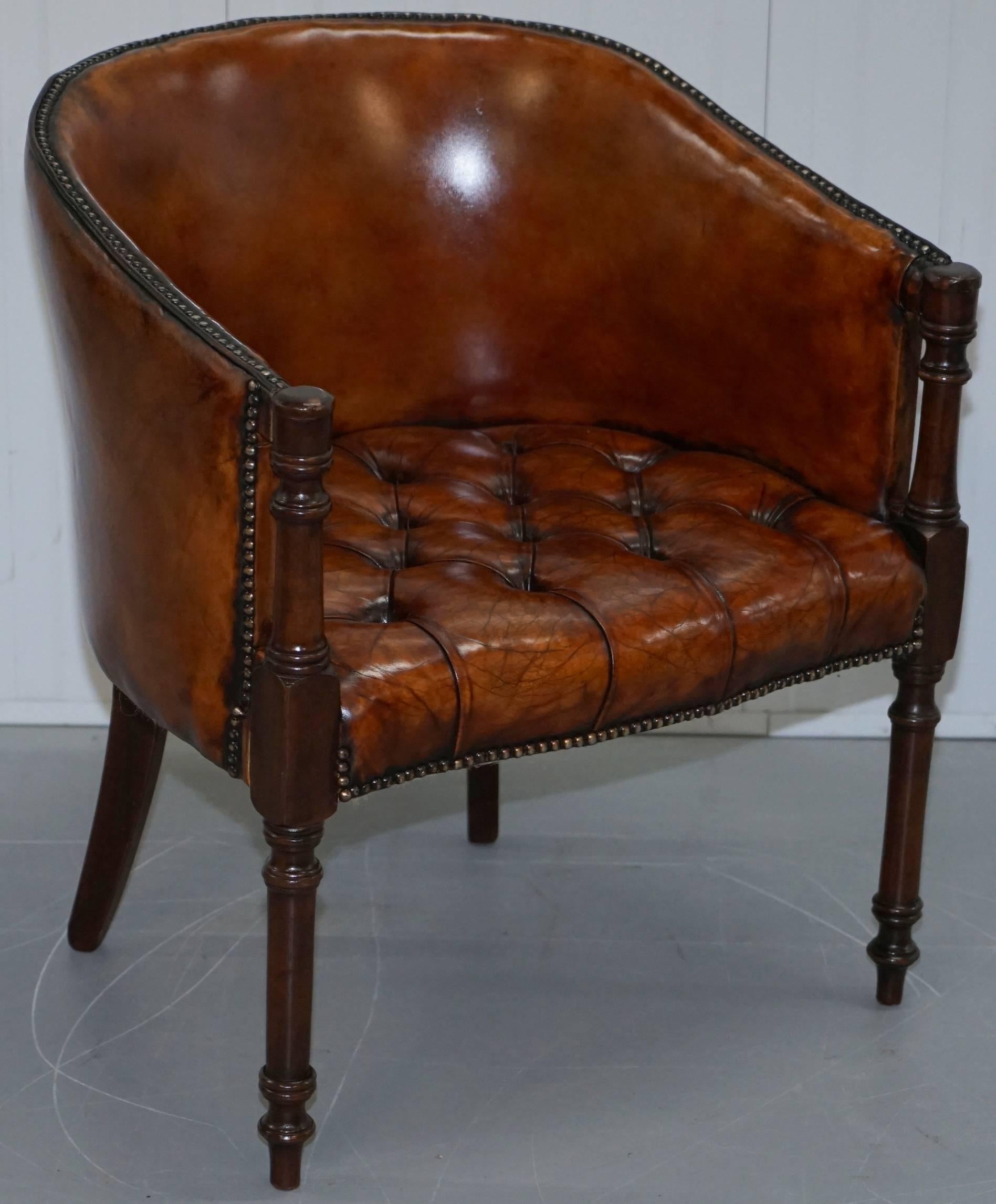 We are delighted to offer for sale this pair of Regency styled, circa 1910 fully restored hand dyed premium russet leather Chesterfield club tub armchairs

Please note the delivery fee is just a guide, for an accurate quote please send me your