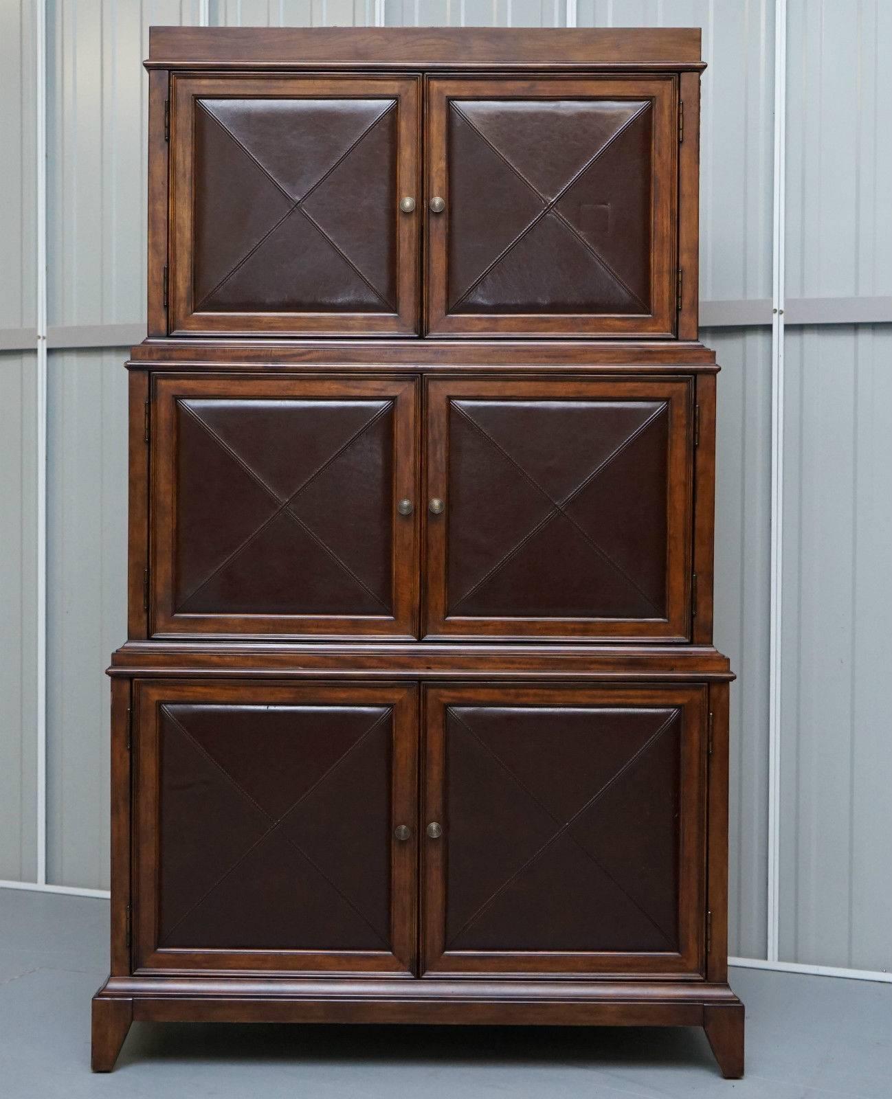 We are delighted to offer for sale this stunning and exceptionally rare hand made to order Bernhardt leather and mahogany entertainment cabinet bookcase

This piece retailed in the high thousands new, it is a genuinely exceptional cabinet

This