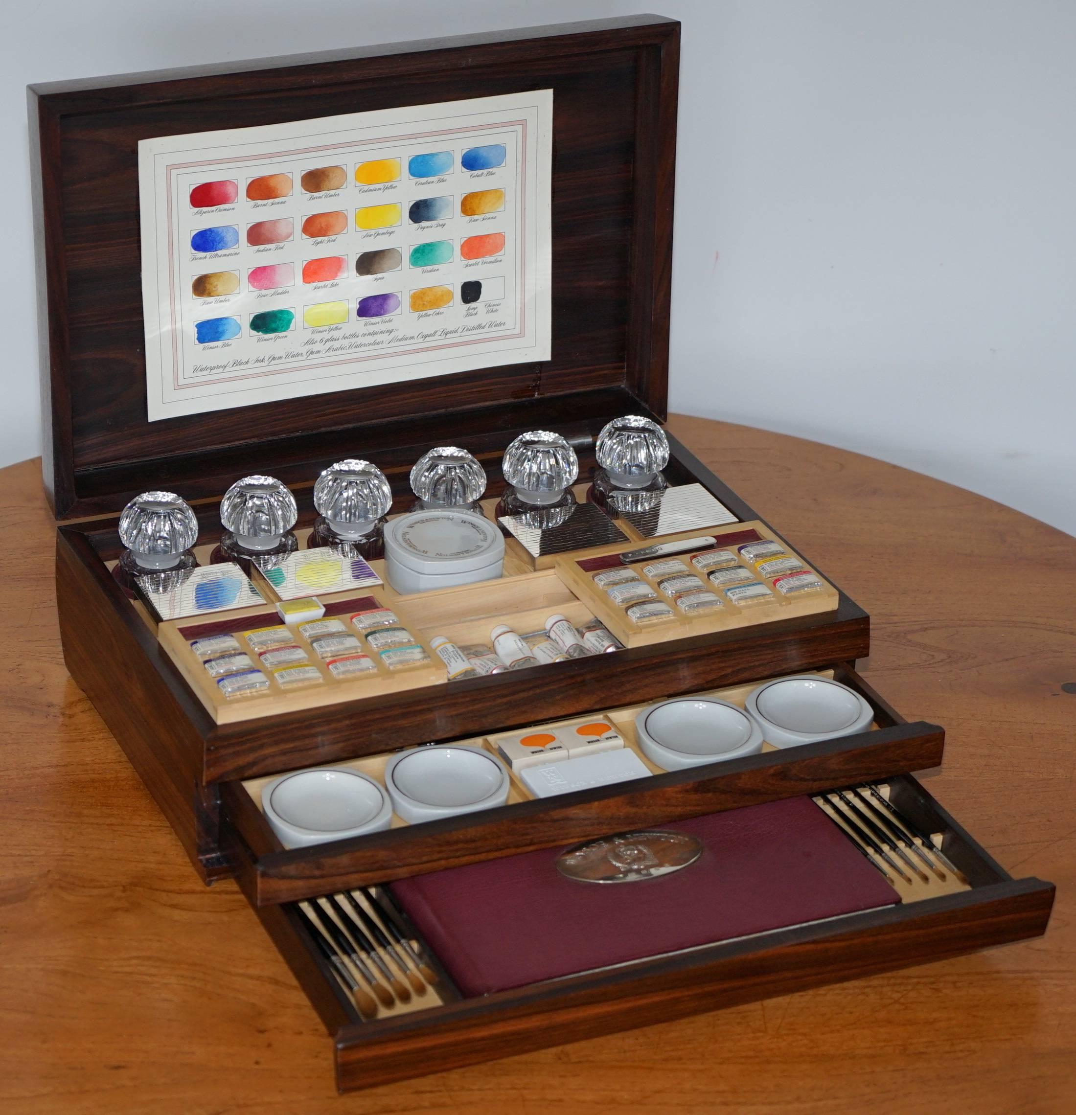 We are delighted to offer for sale this lovely one of a kind Winsor & Newton 1977 Queen Elizabeth Jubilee presentation with sterling silver plaques and boxes Calamander wood Artist box 

Please note the delivery fee listed is just a guide, for an