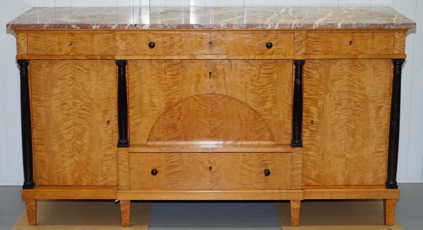 Wimbledon-Furniture

Wimbledon-Furniture is delighted to offer for sale this lovely solid flamed satin birch Swedish circa 1880 Biedermeier sideboard with marble top

Please note the marble top which is removable is cracked right the way through,
