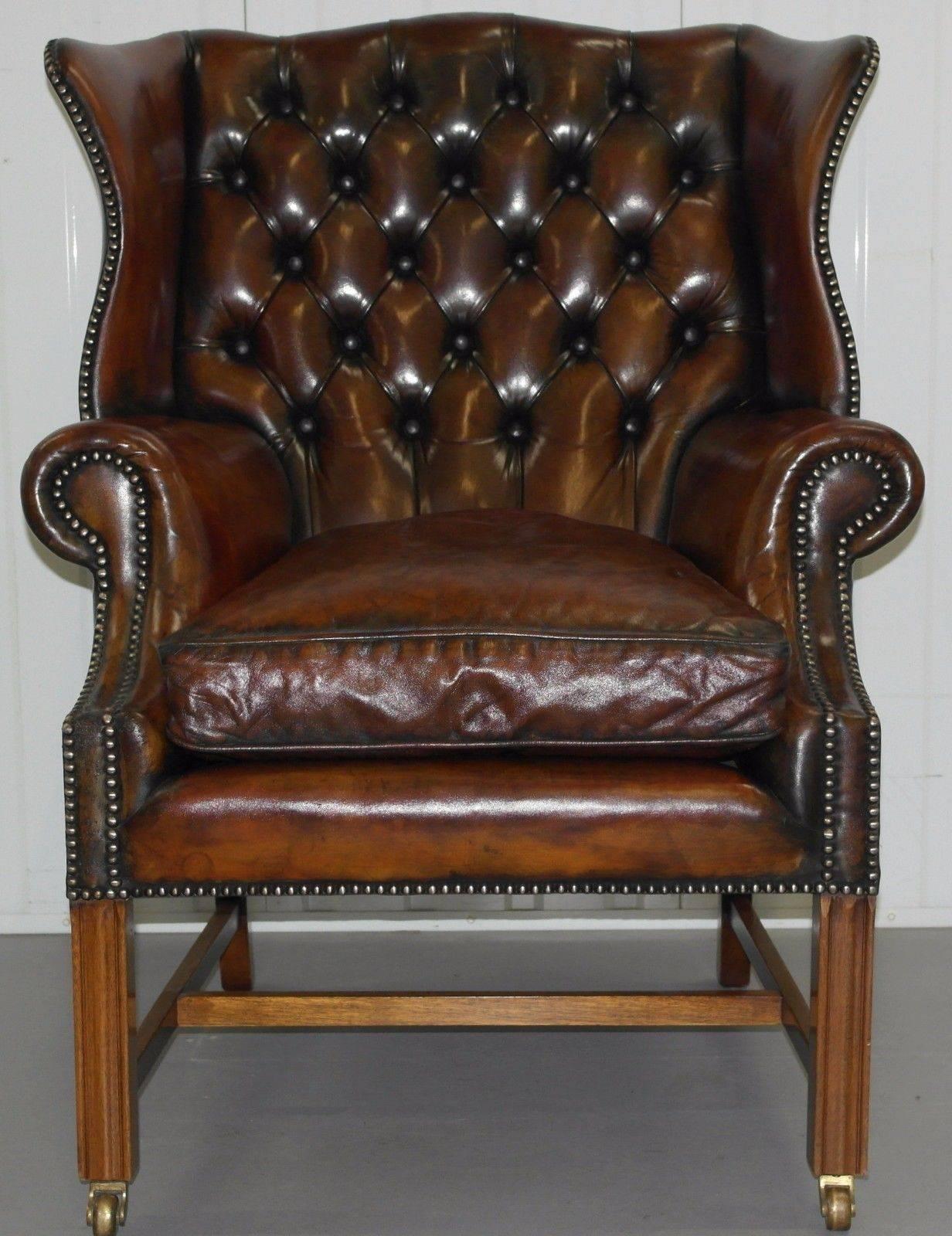 Antique & Vintage furniture Wimbledon 07850 890032

We are delighted to offer for sale this lovely original 1960's hand dyed aged whiskey brown leather fully restored Chesterfield Georgian H Framed wingback armchair with feather filled