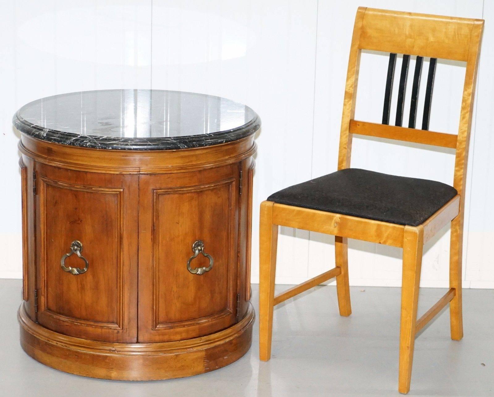 Wimbledon-Furniture

Wimbledon-Furniture is delighted to offer for sale this lovely Regency styled Mahogany drum table with marble top and cupboard internals

Please note the delivery fee listed is just a guide, for an accurate quote please send me