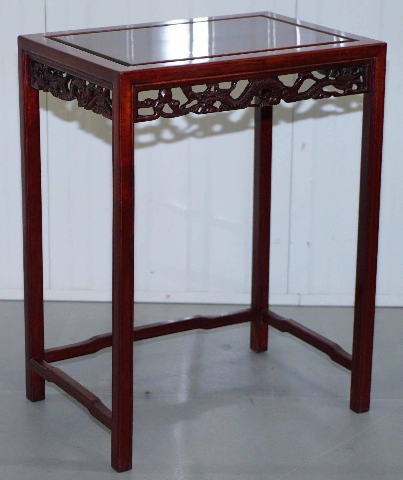 Stunning nest of four Chinese solid rosewood finely hand carved with Dragon detailing nest of tables

These tables retail for £2500-£3500 with all good dealers, these are just about as fine an example as you will see anywhere

A lovely decorative
