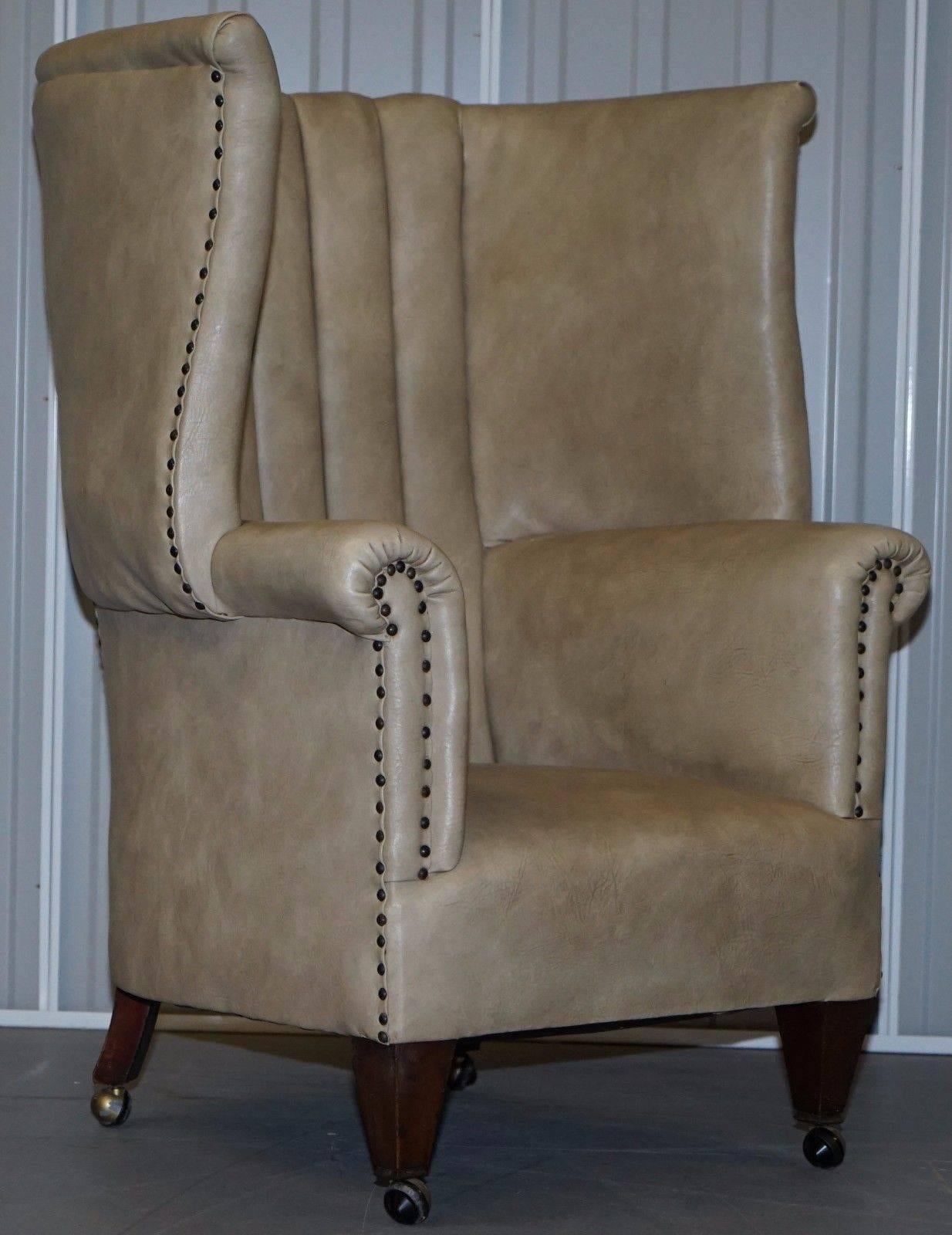 We are delighted to offer for sale this stunning original circa 1830 wingback porters chair in solid mahogany with faux leather upholstery 

A really rare find and with very desirable proportions, the back is barrel to offer ample room, wingback