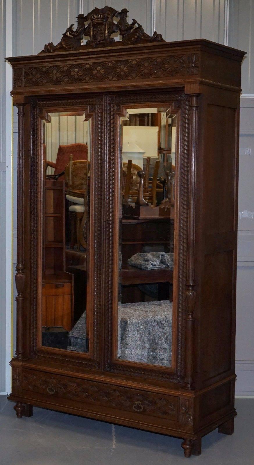 We are delighted to offer for sale this absolutely stunning handmade in France Armoire wardrobe with mirrored doors

This piece can have a metal railed fitted for £30 or a large stained wood rail fitted for £50. The shelves are all removable so