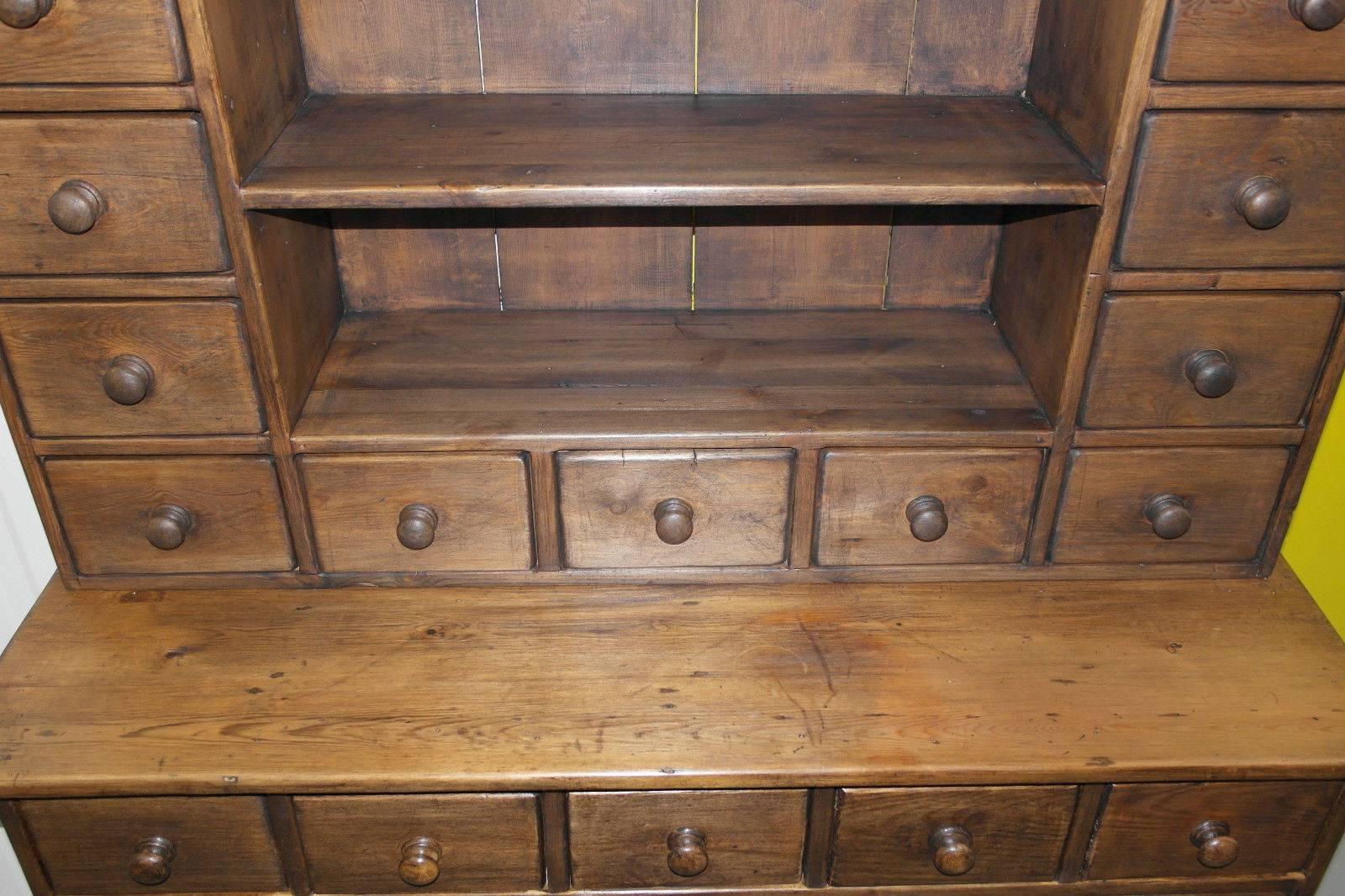 We are delighted to offer for sale this very rare lightly stripped and waxed polished Victorian merchants dresser or Haberdashery apothecary bank of drawers in the form of a dresser

This is a very rare piece, I’ve never seen one quite as good as