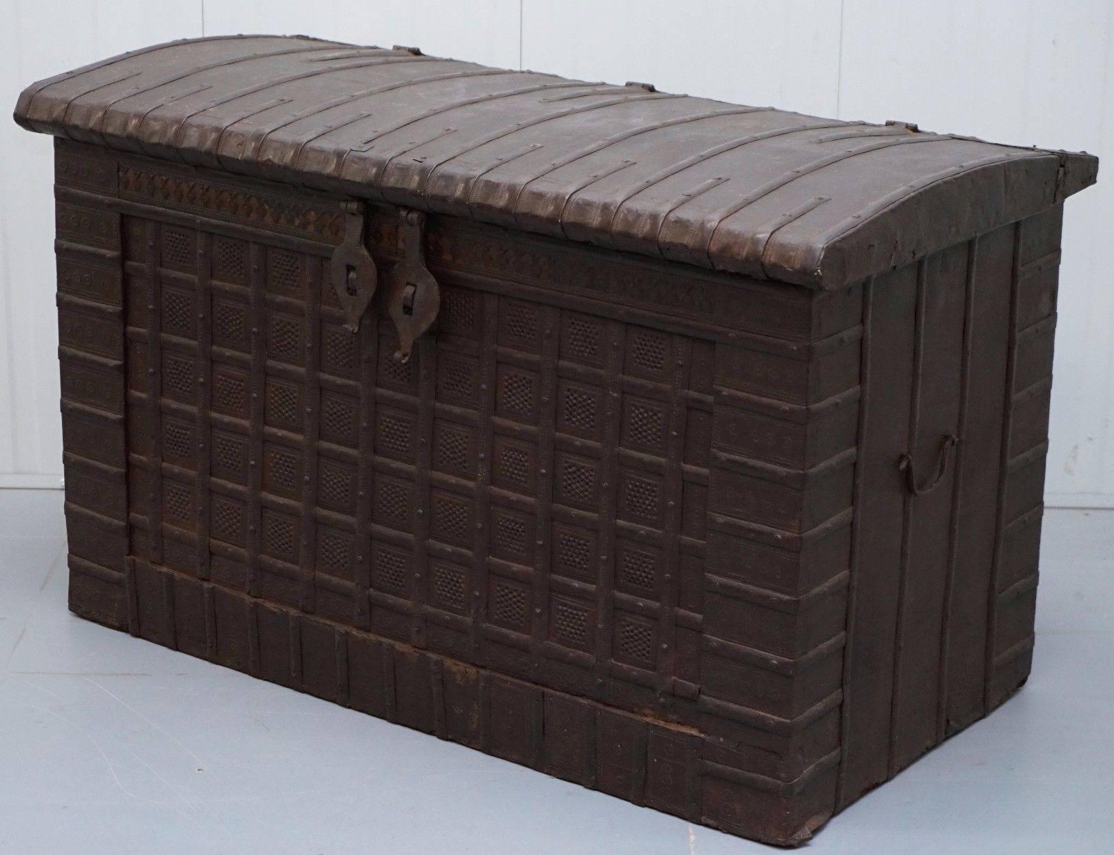 We are delighted to offer for sale this very rare circa 1850 extra grand solid iron with teak insides Rajasthani trunk or chest
 
Its mid-19th century, solid teak and iron banded trunk, Indian in origin and typical of the Rajastan antique