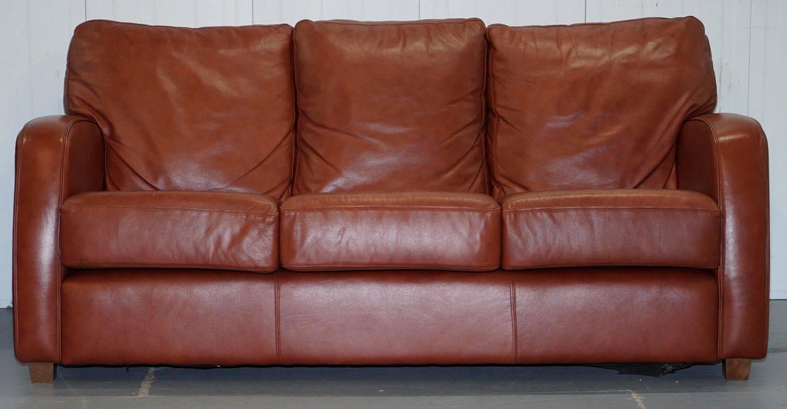 We are delighted to offer for auction this lovely saddle brown leather three-seat sofa

A lovely looking and very comfortable sofa, the base cushions are medium firm the back is medium soft, the IDEA being you don’t sink down you sink a little