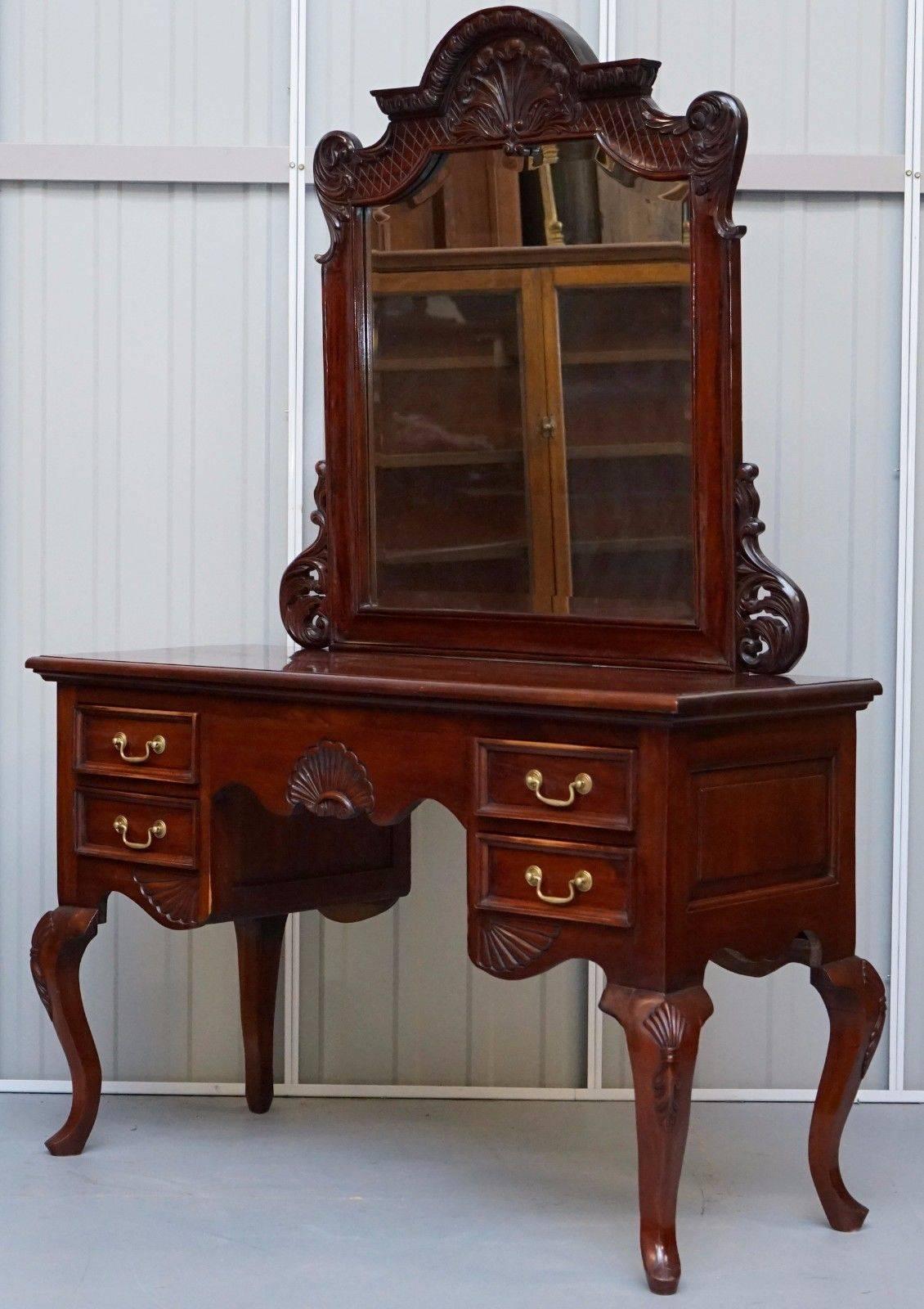 We are delighted to offer for sale this lovely solid nicely carved mahogany dressing table with mirror and chair

A great pair in fantastic condition, the mirror is slightly arched forward so you can see yourself in all your splendor!

Condition