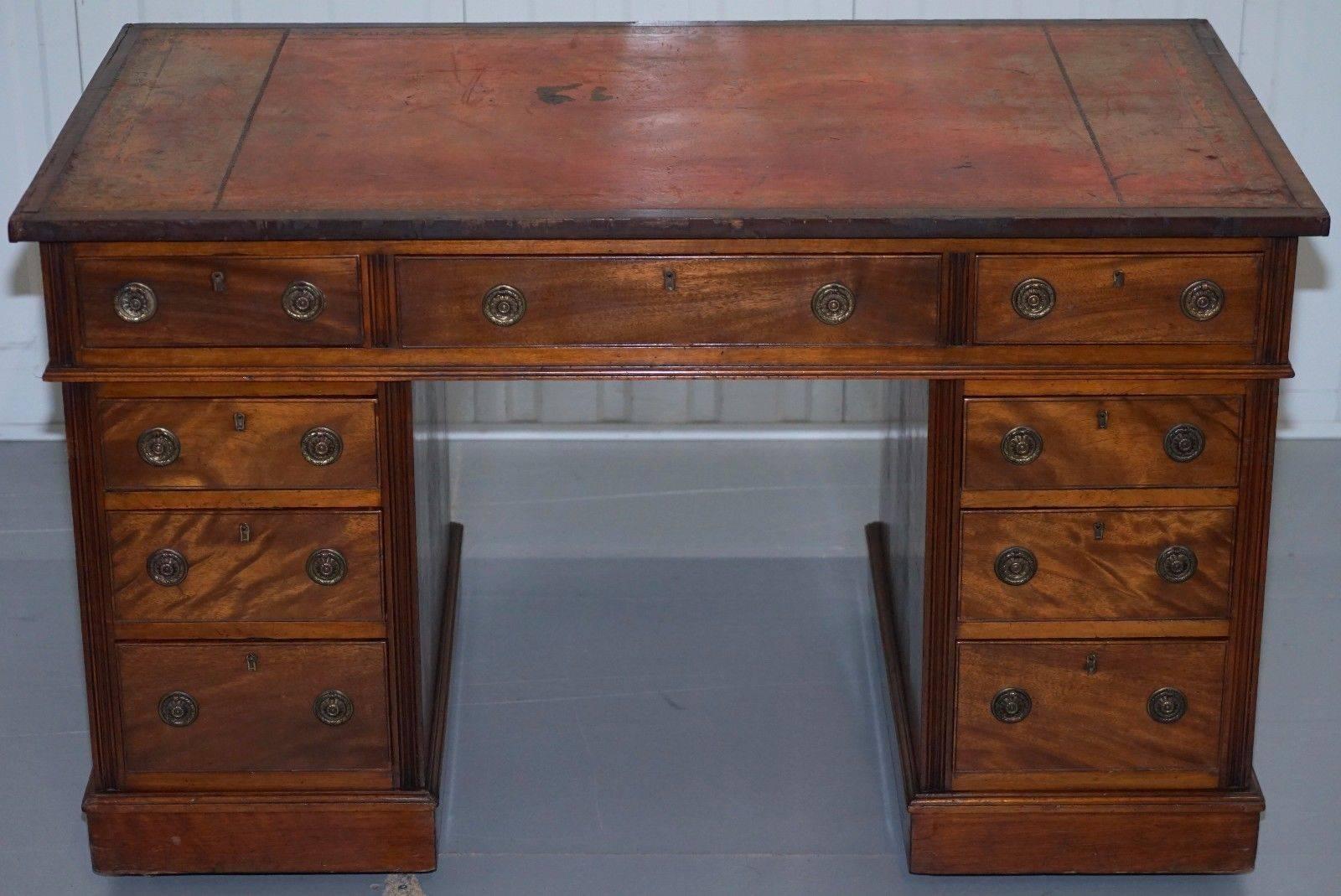 We are delighted to offer for sale this 100% original and period correct mahogany with leather writing surface twin pedestal partner desk

Very original and unrestored with a heavily distressed leather surface and timber splits to prove it! The