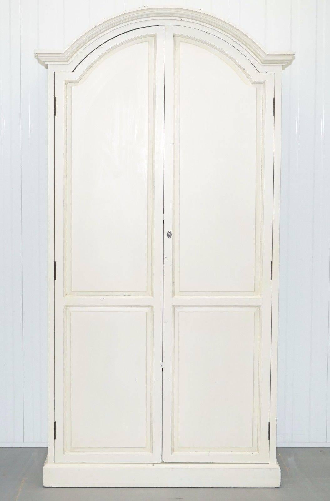 We are delighted to offer for sale this absolutely stunning vintage French country style farmhouse wardrobe with hanging rail, multiple adjustable shelves, and lock

A very good looking heavy and well-made piece with nice arched top and removable