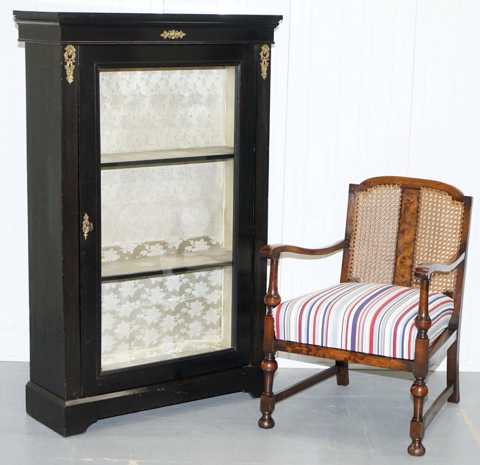 We are delighted to offer for sale this stunning Victorian ebonised with gilt metal headwear bookcase display cabinet

This cabinet has the original key but it doesn’t seem to work, it’s a large grand well-made piece that really is very