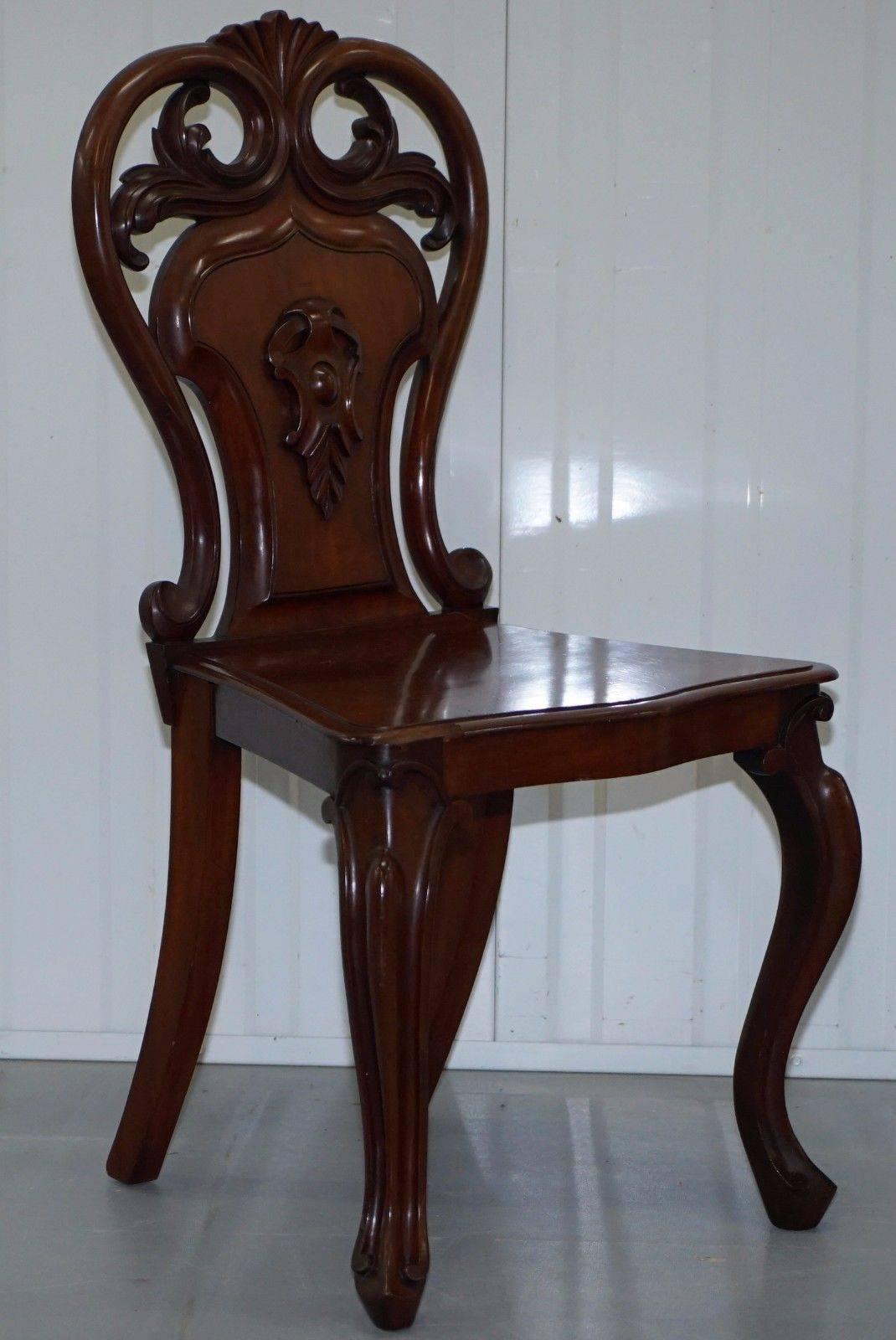 We are delighted to offer for sale this stunning pair of Victorian, circa 1870 solid mahogany hand-carved shield back hall chairs

These would look at home in a period medieval castle and in a city townhouse, they are stylish and charming, the