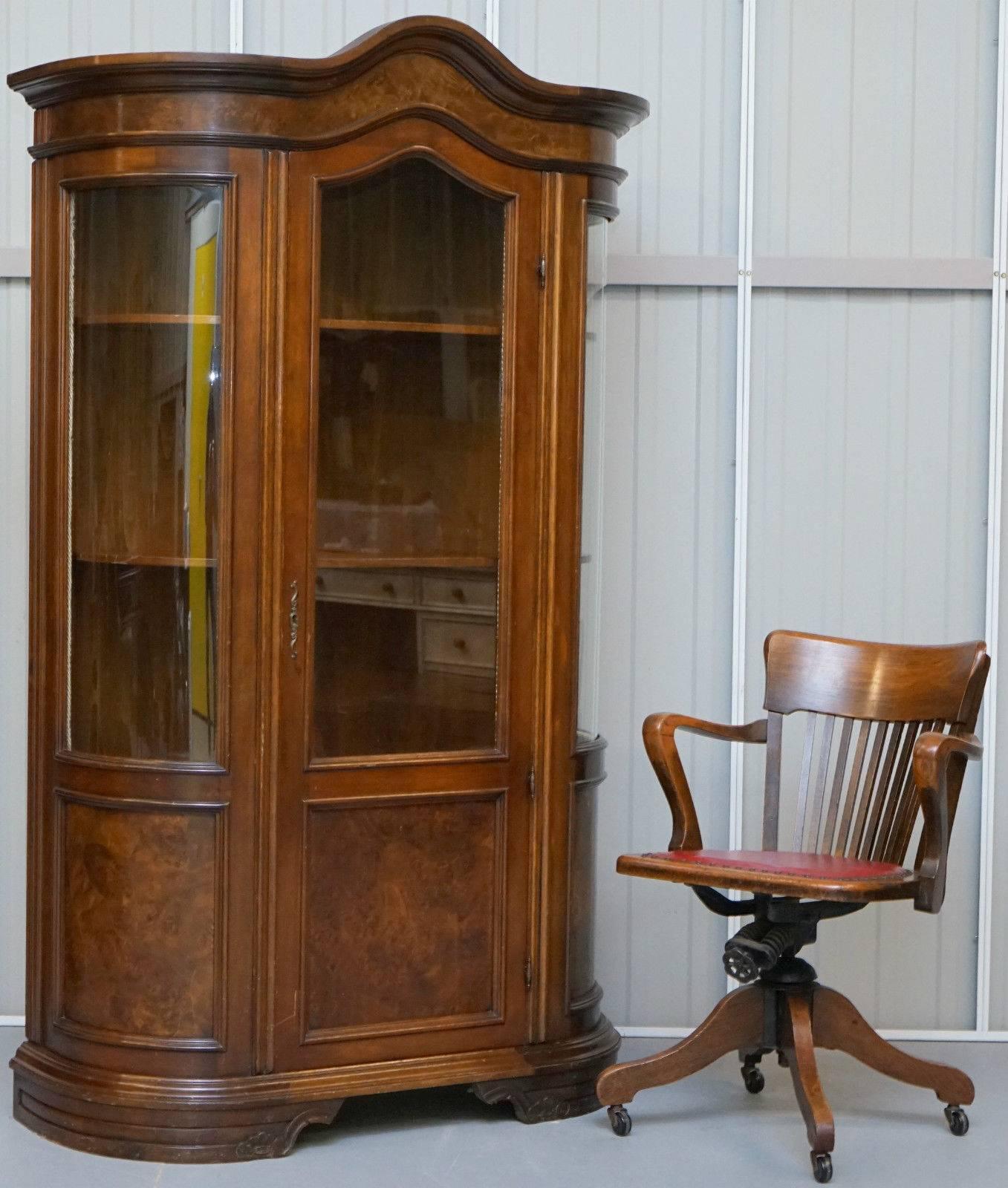 We are delighted to offer for sale this very grand and stylish walnut and mahogany veneered English Regency styled glass doored display cabinet bookcase

A lovely grand and splendid looking piece, it has elements of French Empire grandeur with the