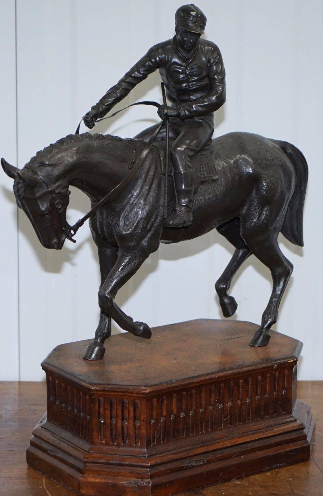 We are delighted to offer for sale this very large solid bronze Equestrian Horse & Jockey on a walnut painted base

A very good looking substantial and exceptionally heavy piece, the base seems to be walnut or simulated walnut, it sets the statue