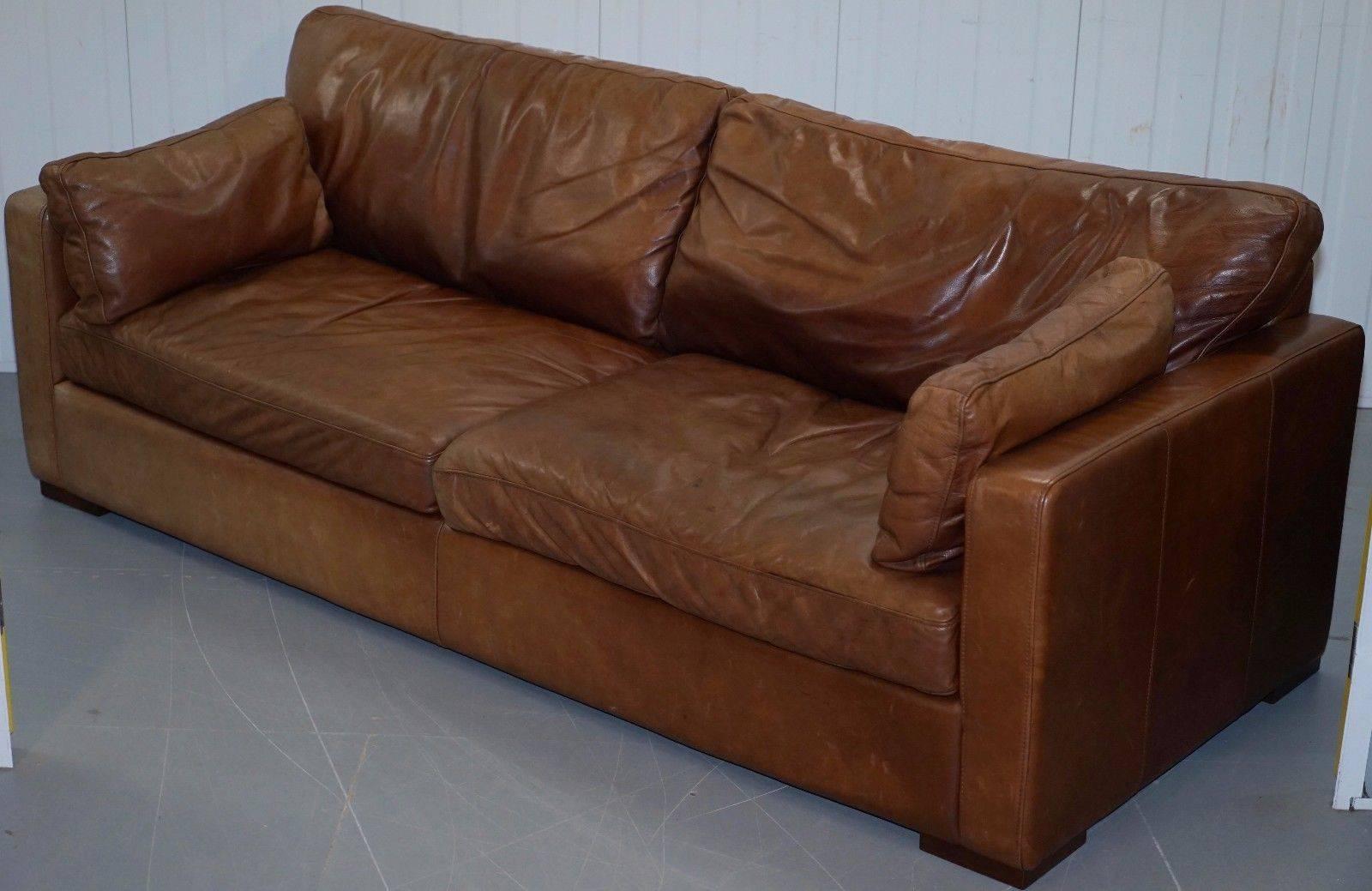 Wimbledon-Furniture is delighted to offer for sale this House Of Fraser aged brown distressed leather four-seat sofa

A very good looking and well-made piece, upholstered with thick full aniline leather which is upholstered plain and then hand